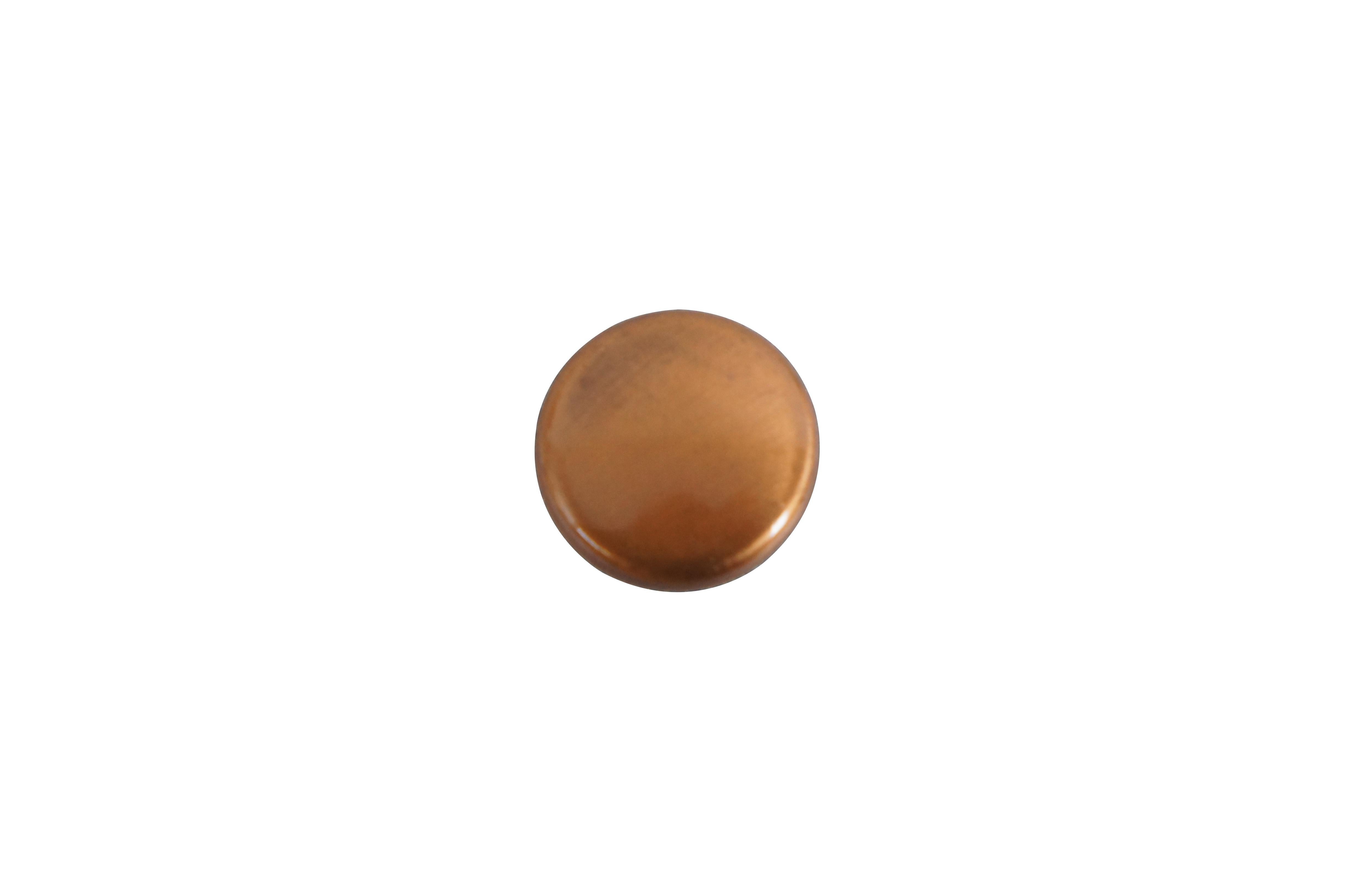62 Available - Mid to late 20th century old-stock die cast drawer / cabinet pulls. National Lock Company - Medalist. Brushed copper finish. Round shape with tapered back and black cap.

DIMENSIONS:
1