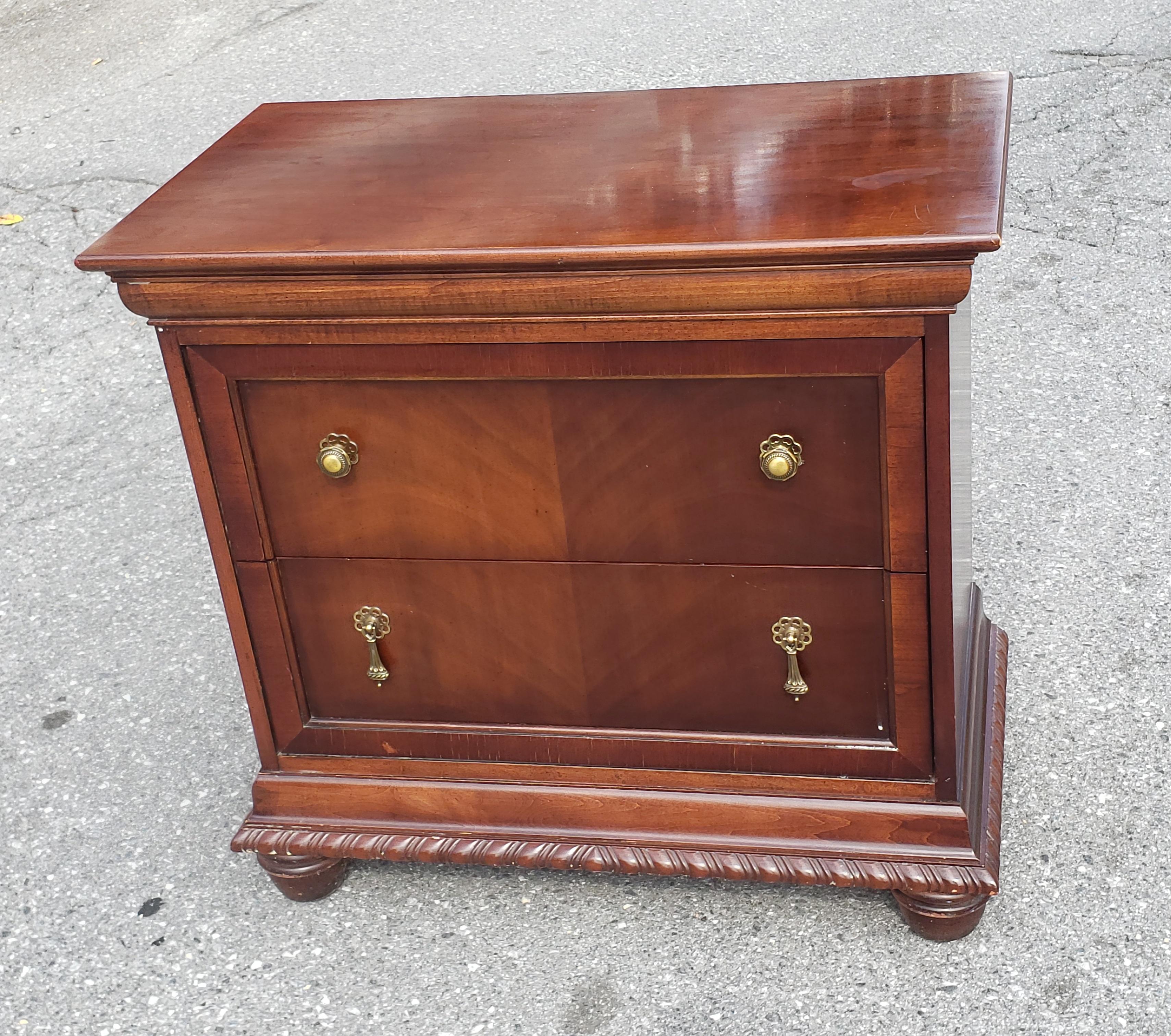 A well kepth 1980s National Mt Airy furniture Bookmatched Mahogany Bedside Chest of Drawers / Nighstand. Very well constructed. Mahogany bookmatched veneer drawer door on mahogany. Very good vintage condition. We have the matching bed and dresser in