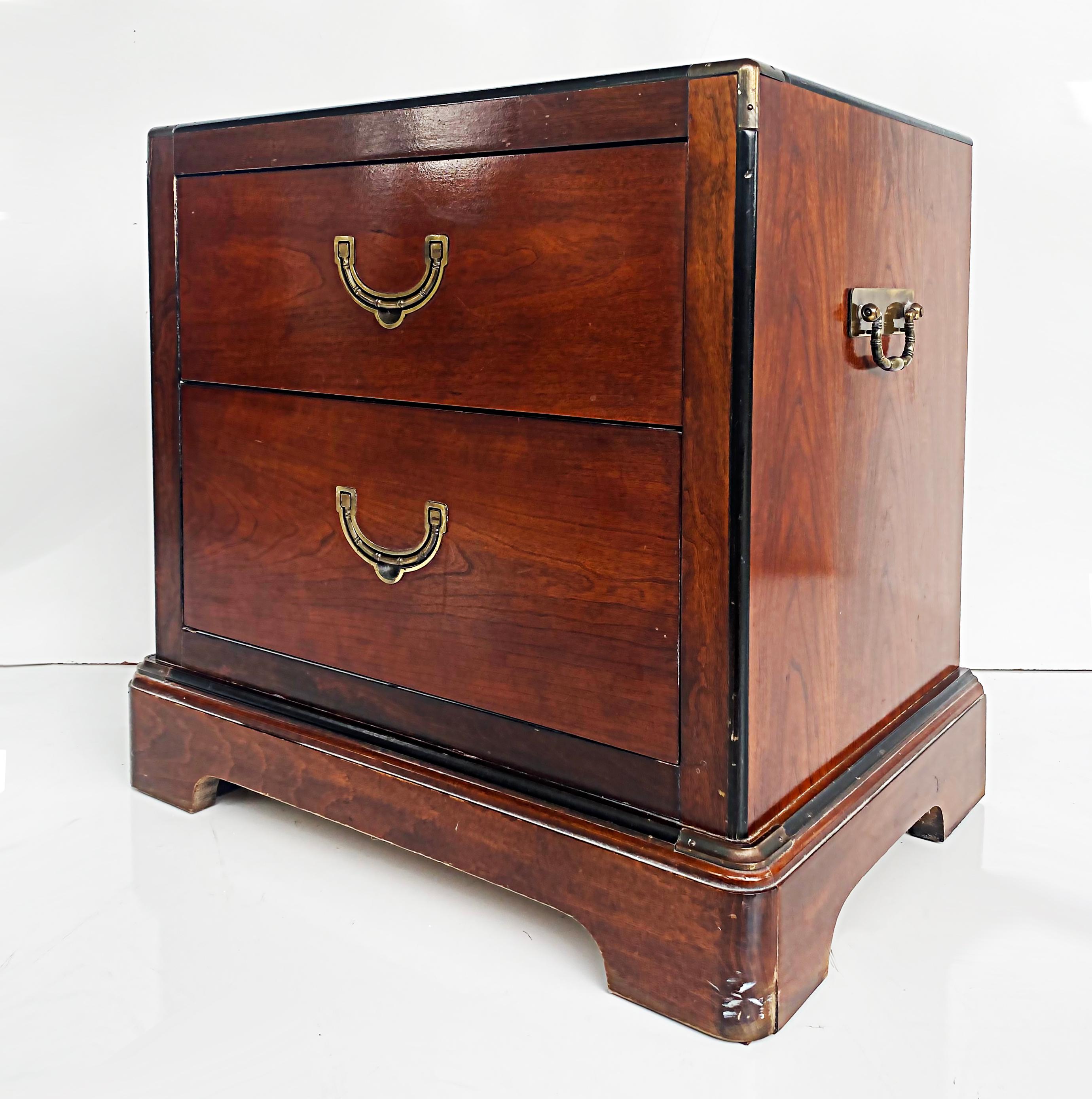 National Mt. Airy mahogany campaign style night stands with brass hardware, pair.

Offered for sale is a pair of Mahogany campaign-style chests or night-stands manufactured by the National Mt. Airy Furniture Company. The night-stands have faux