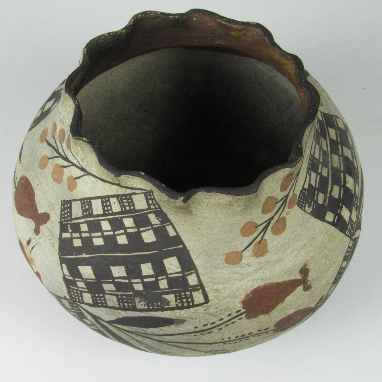 Native American Acoma Redware Pot, early 20th century; with black, white and brown floral and checkerboard decoration with ruffle rim. Diameter: 5 1/2 inches, height: 5 inches.