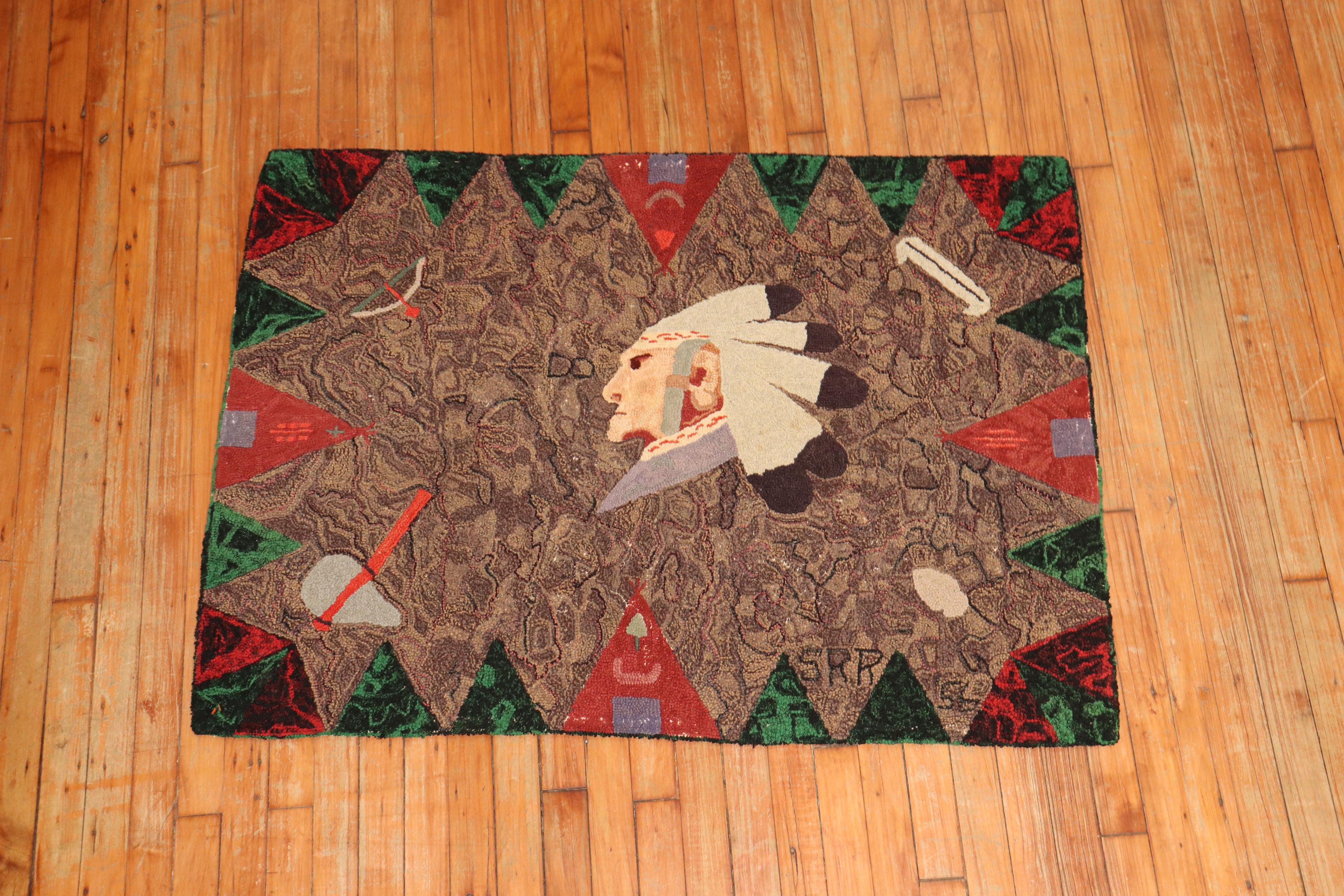 A handmade American hooked rug from the mid-20th century depicting a head of a Native American on a brown field. Condition is really nice. No stains, no tears, has been professionally cleaned.
The border has some interesting triangle shaped motifs