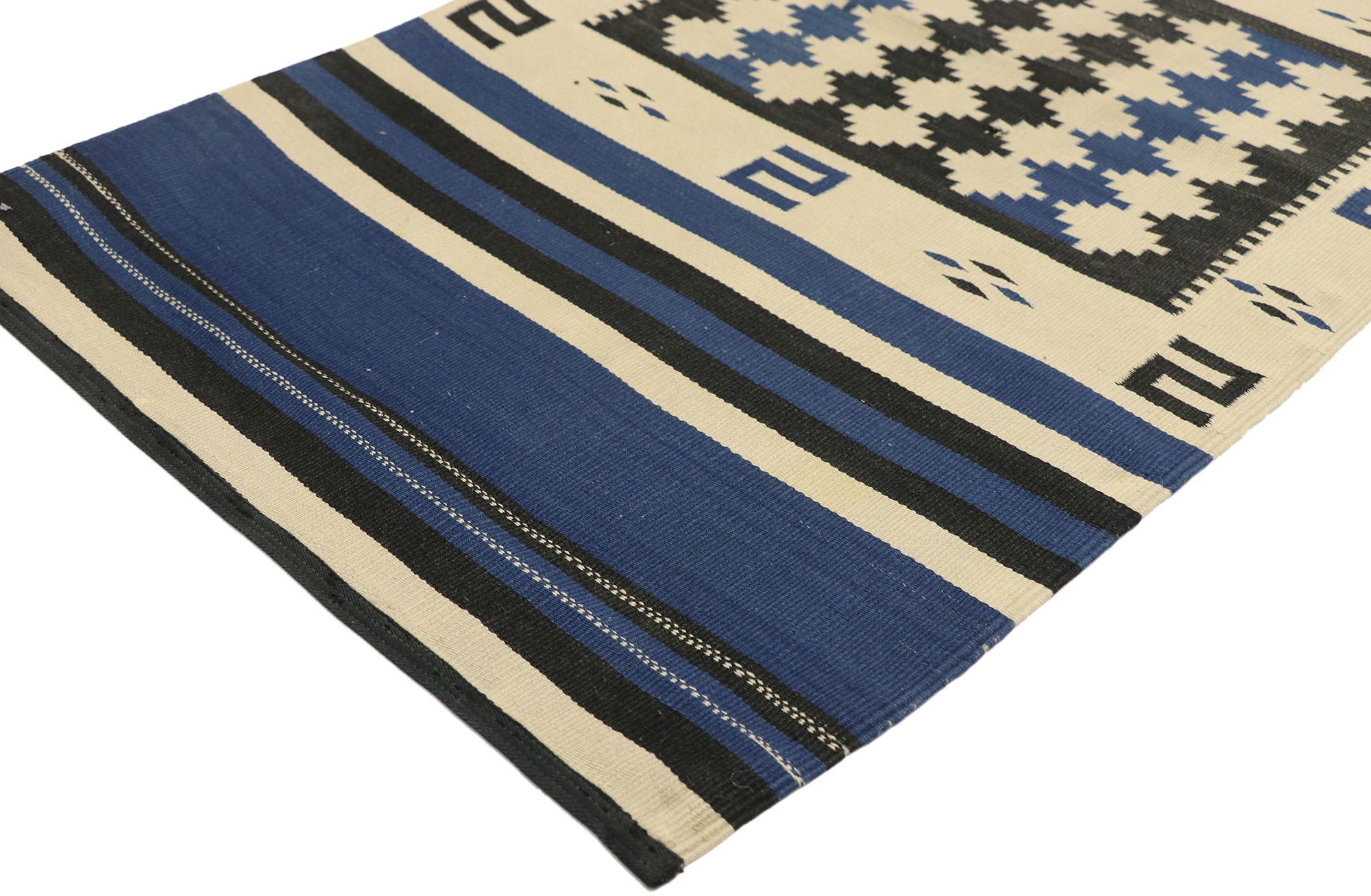 72550 Native American Antique Indian Navajo Kilim Rug, Navajo Saddle Blanket 02'01 x 04'01. This hand-woven wool Native American antique Indian Navajo kilim rug features a large black square filled with stepped diamonds in the center flanked with