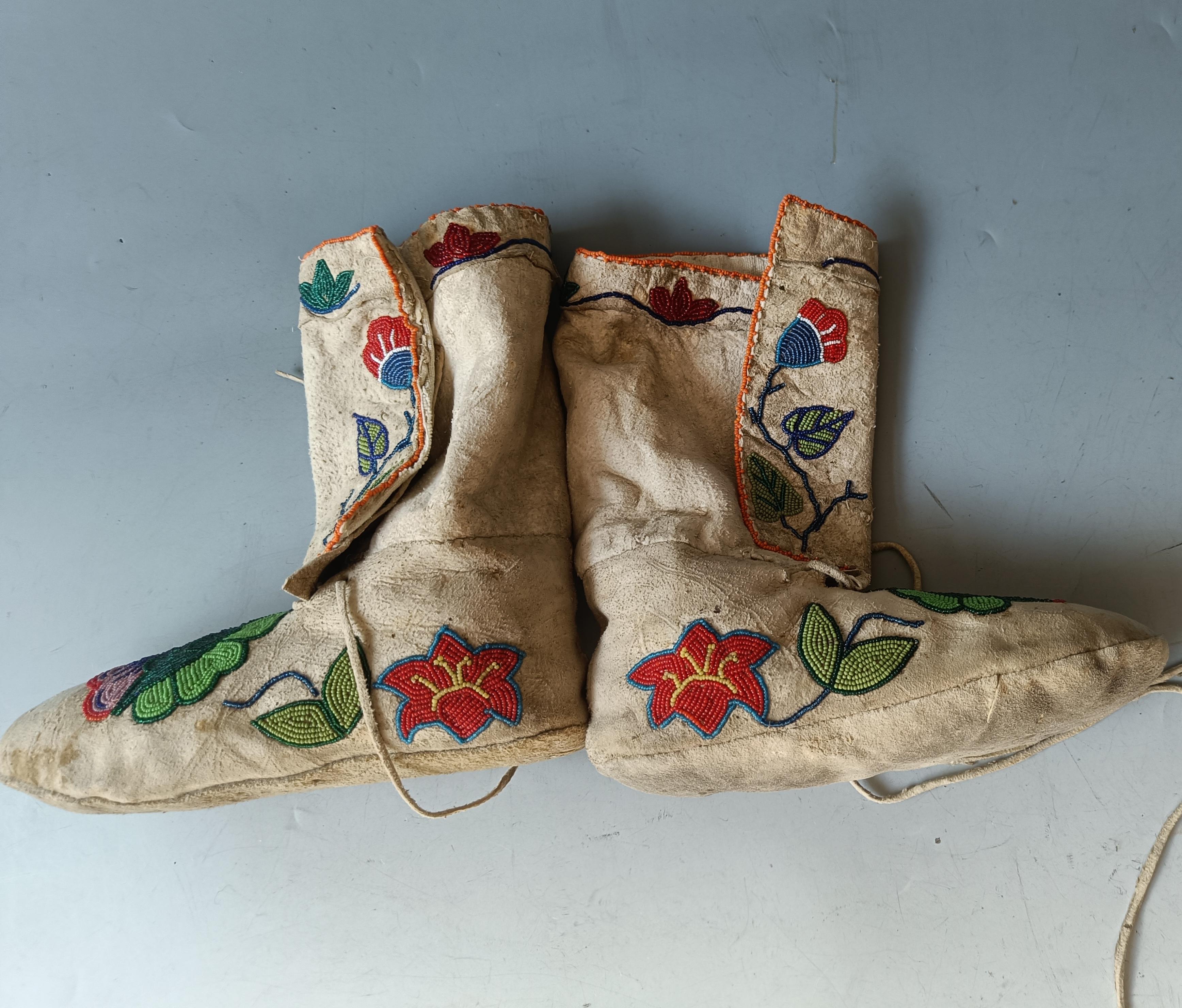 Native American Beaded Moccasins Plateau

A pair of mid length moccasins in buckskin with glass beaded floral designs   

Period:    Late 19th century

Condition: Fine.

Provenance: Ex UK collection