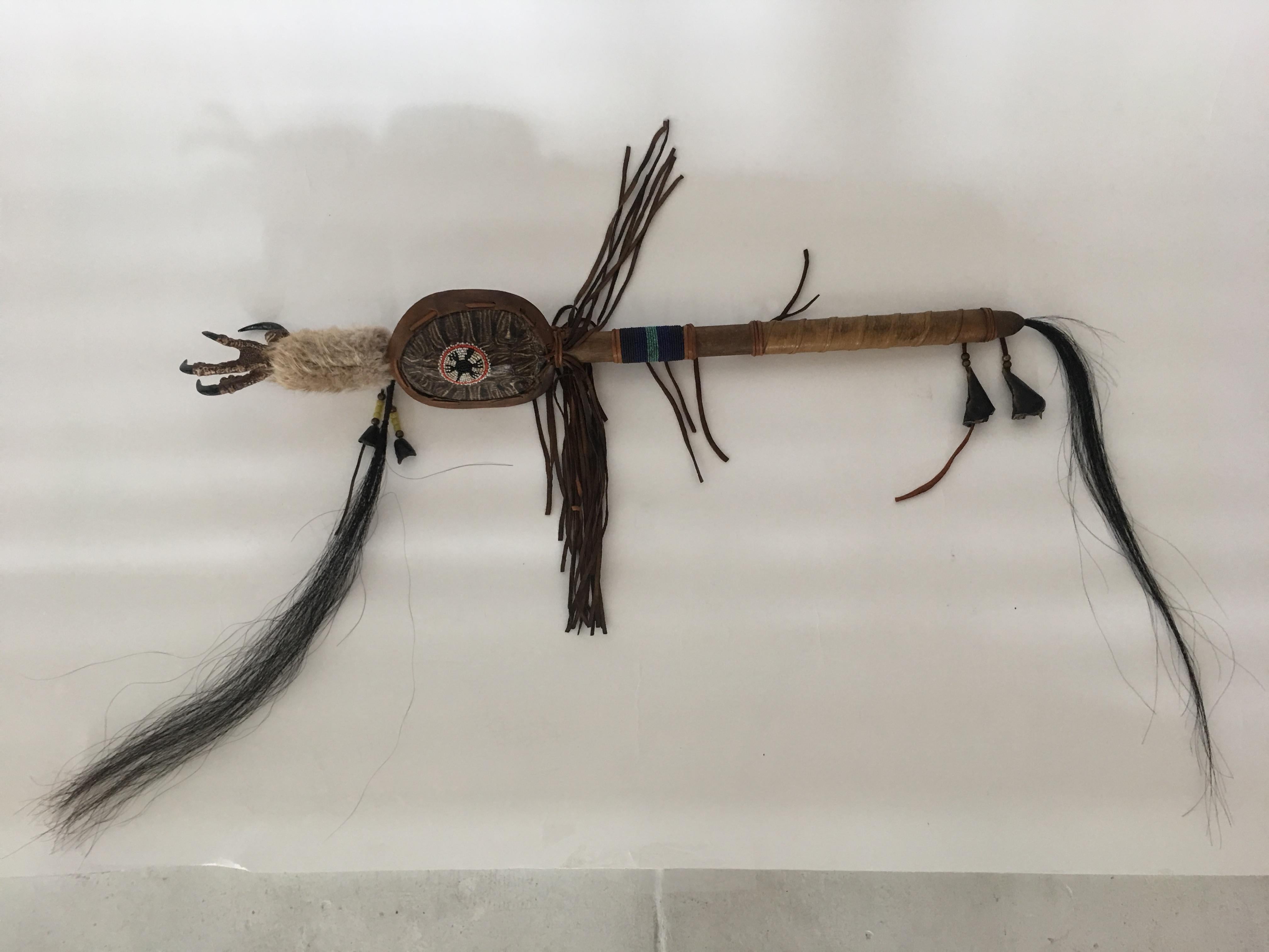 Handmade Native American art piece. Every object that makes up this piece has a significant meaning. Metal stand included, which measures 7