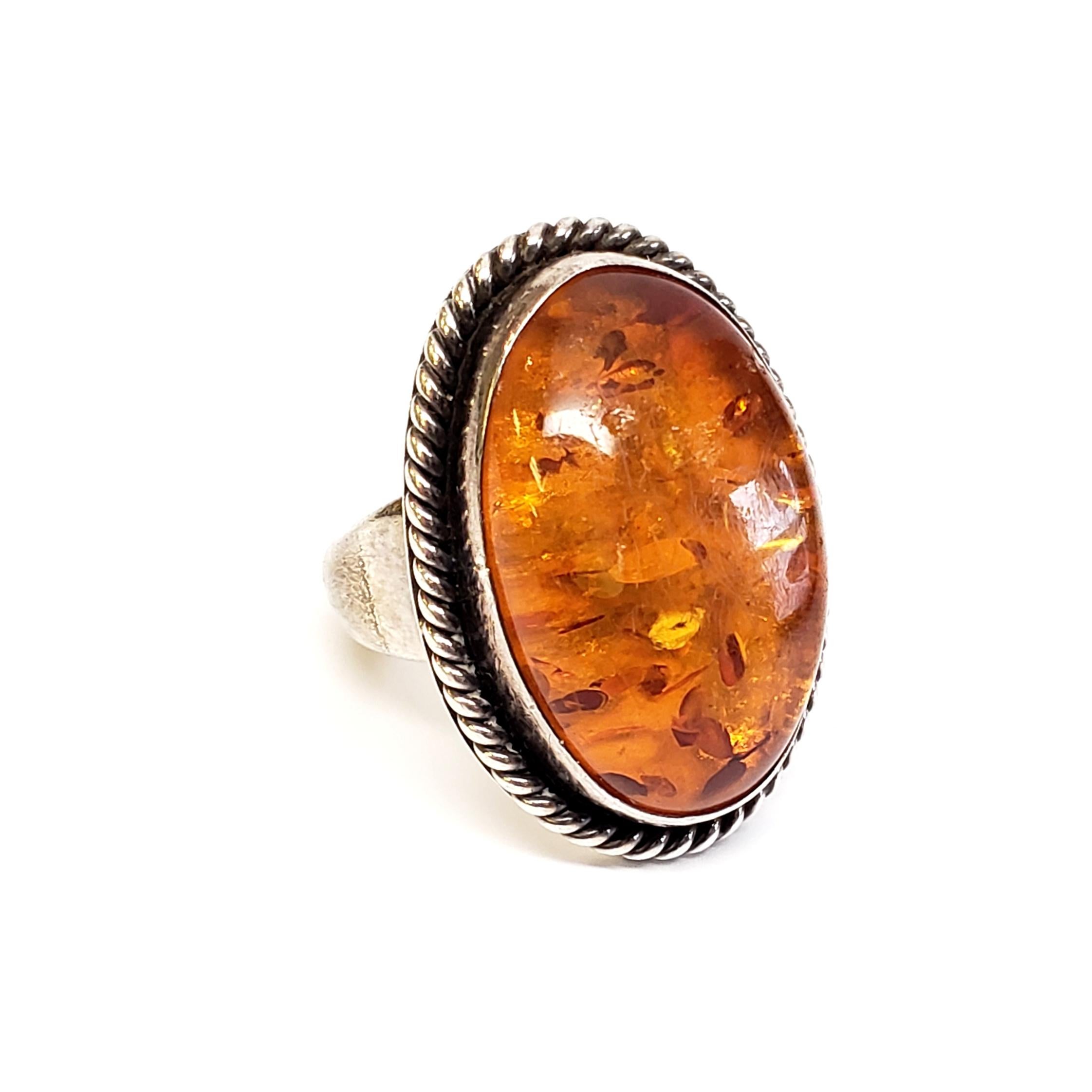 Sterling silver amber ring by Native American Navajo artisan, Artie Yellowhorse.

Size 6 3/4

Artie Yellowhorse is known for her contemporary designs combined with exceptional craftsmanship and quality materials. Her pieces are truly wearable art.