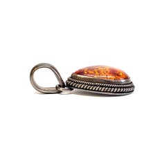 Native American Artie Yellowhorse Sterling Silver and Amber Pendant