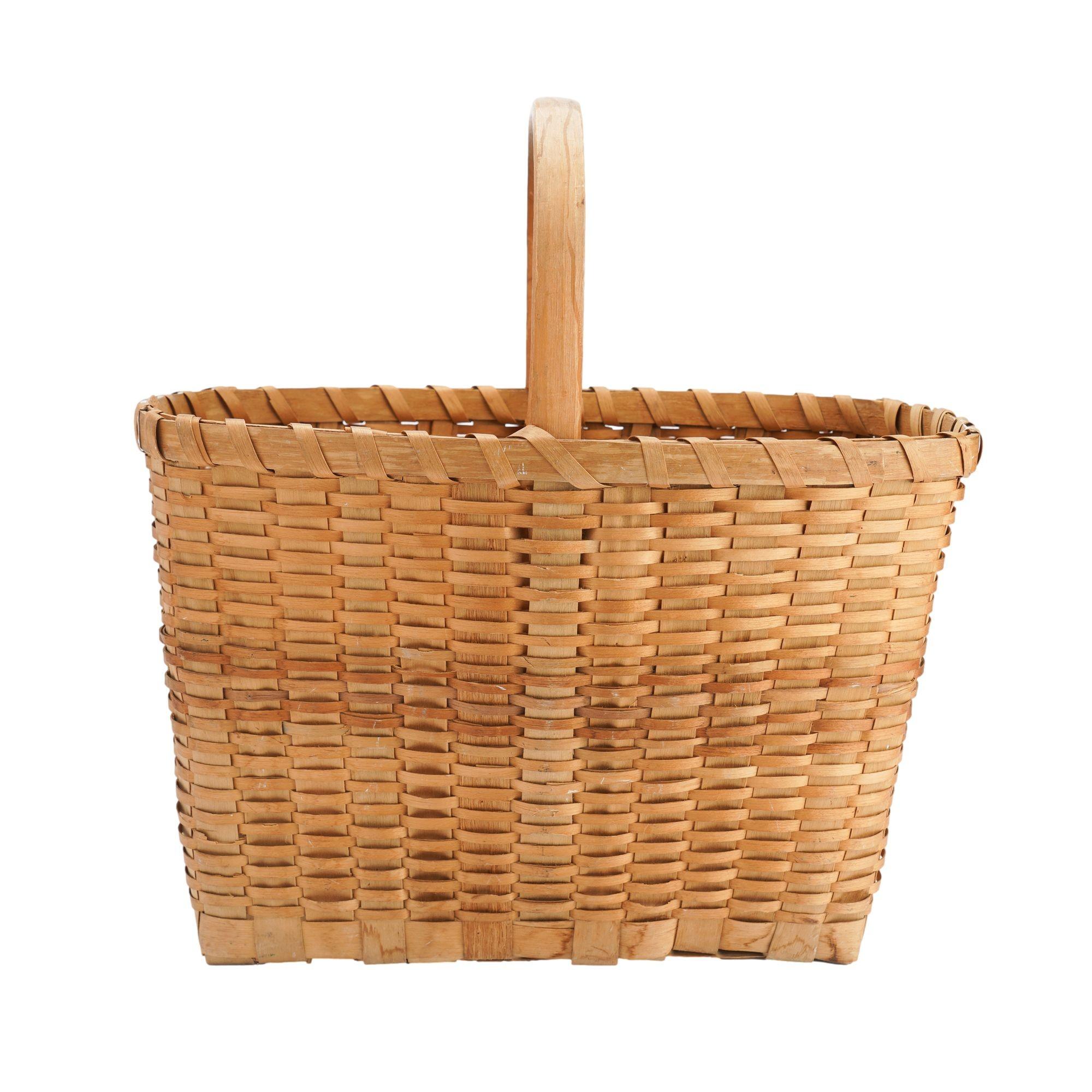 Native American Winnebago/Ho-chunk hand carved & woven ash splint basket with loop handle. The rim of the basket is captured by two carved and bent ash splines with 1/4
