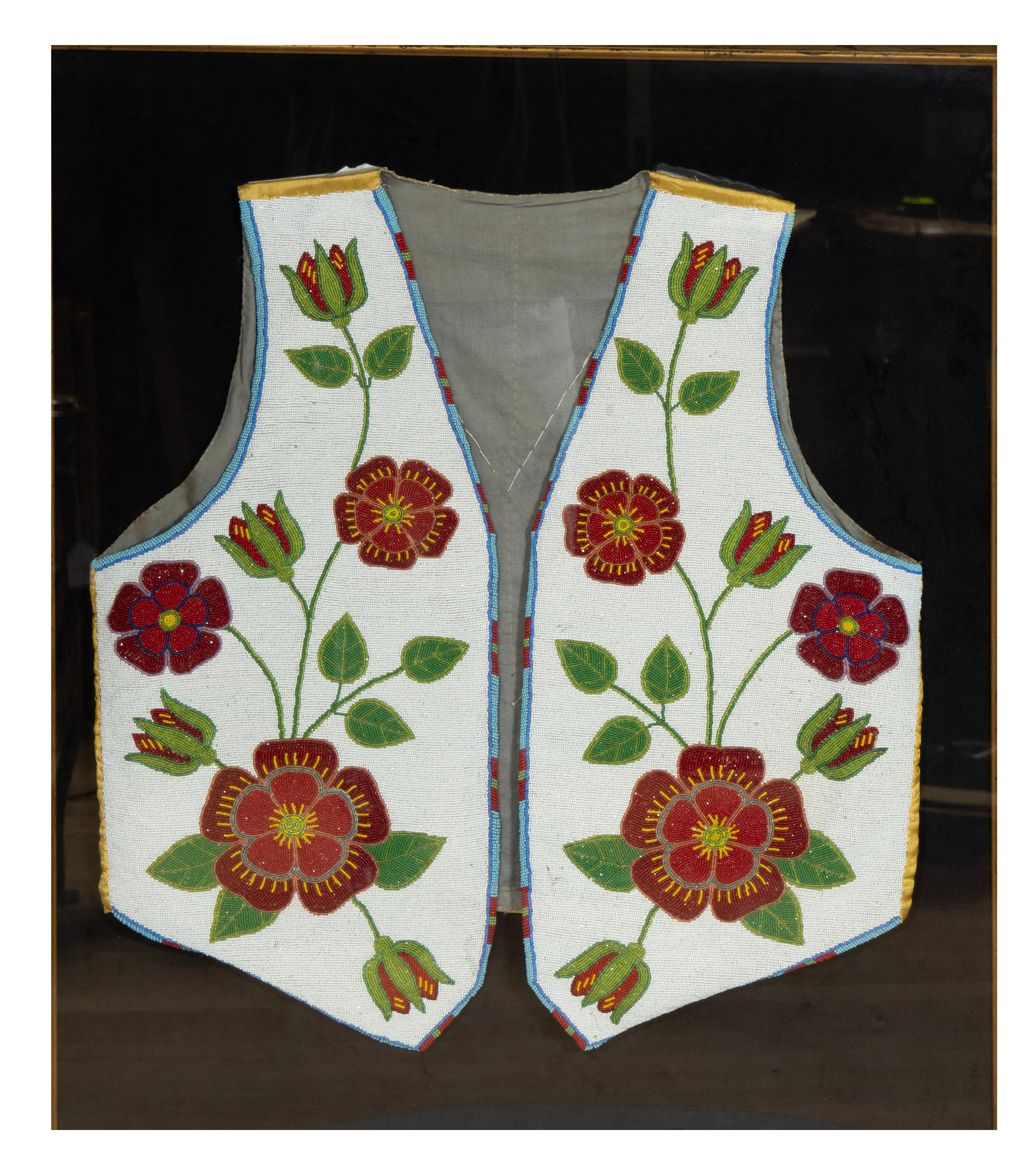 Probably Nez Perce  [Plateau] with fully beaded front with flowers and leaves. In a wood frame box with glass cover. From the estate of Bartlett Burnap.