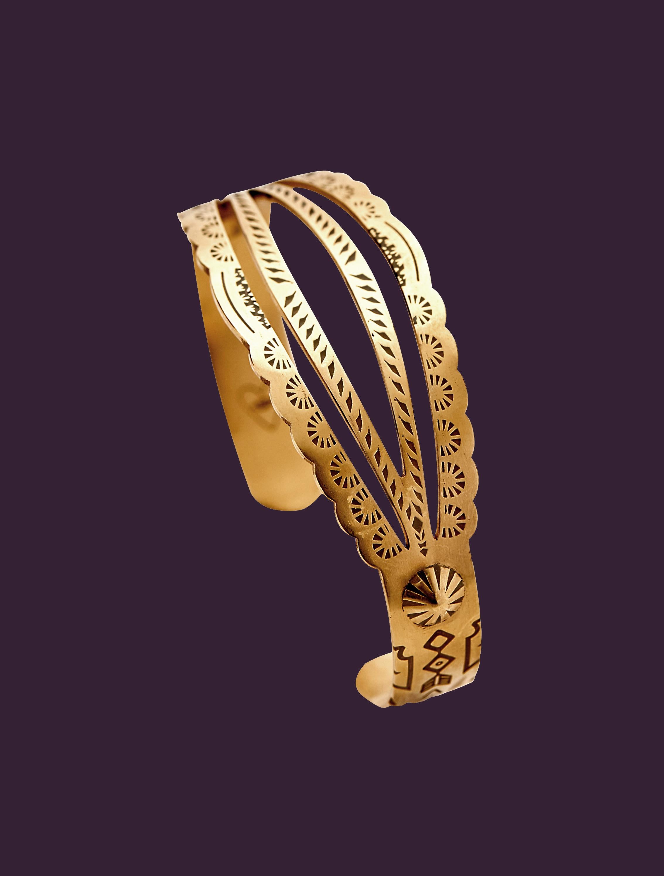 The cuff bracelet is designed by Christina Alexiou.
This cuff bracelet is crafted with 18k yellow gold. As designer Christina Alexiou notes, she draws on jewellery’s ancient purpose as “a symbol of culture and tribe.”The design of this bracelet 
