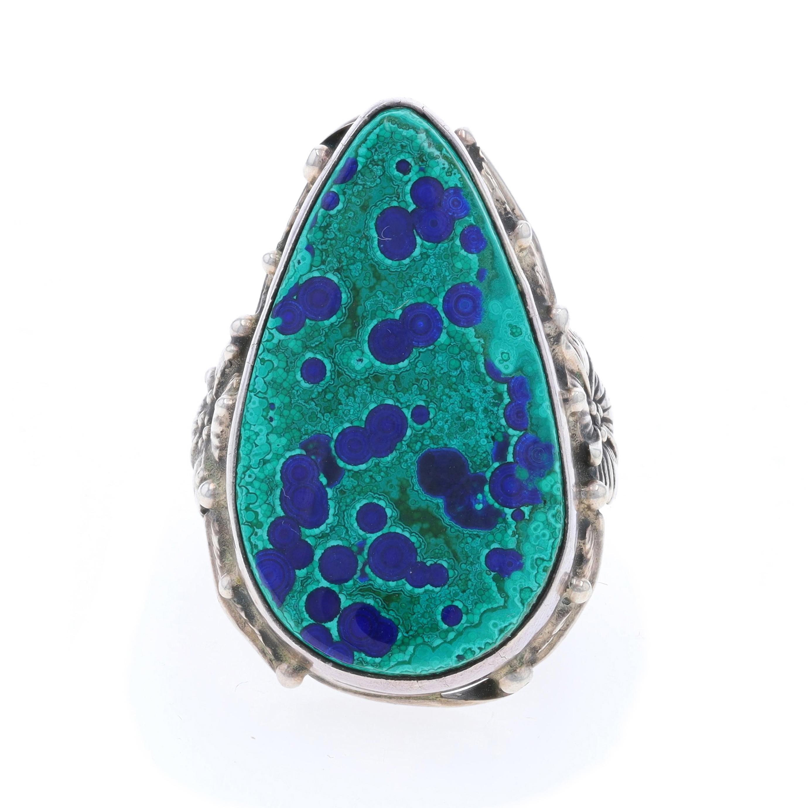 Size: 8 1/2
Sizing Fee: Up 1 size for $25 or Down 1 size for $25

Native American
Artisan: Carol Felley
Tribal Affiliation: Navajo

Metal Content: Sterling Silver

Stone Information

Natural Azurite Malachite
Color: Green & Blue

Style: Cocktail