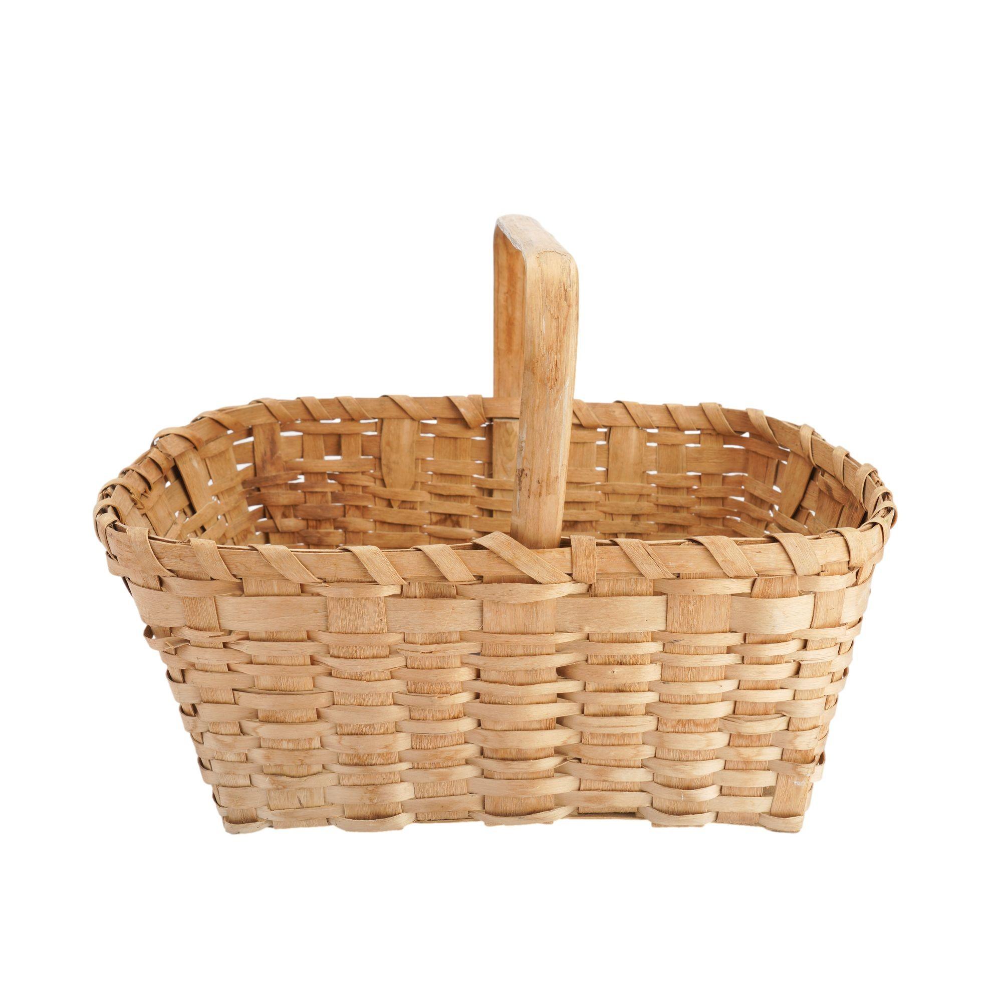 Native American splint ash basket with carved and bent fixed loop handle which has been flattened at the apex. The rim of the basket is comprised of two 3/8