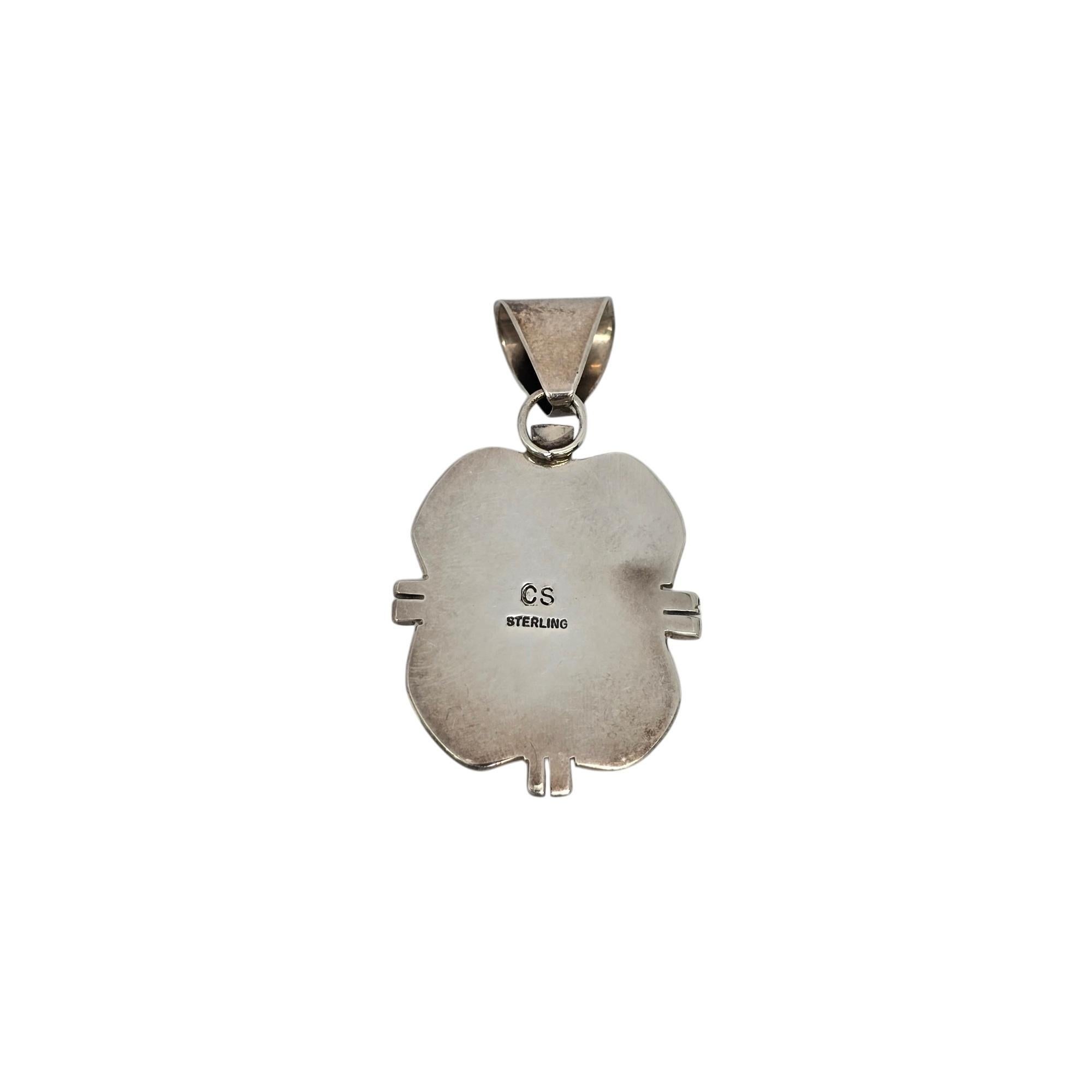 Sterling silver and charoite pendant by a Native American artisan, Cecil Sanders.

A large oval purple charoite stone is bezel set in a sawed edge pendant.

Measures approx 2 1/2