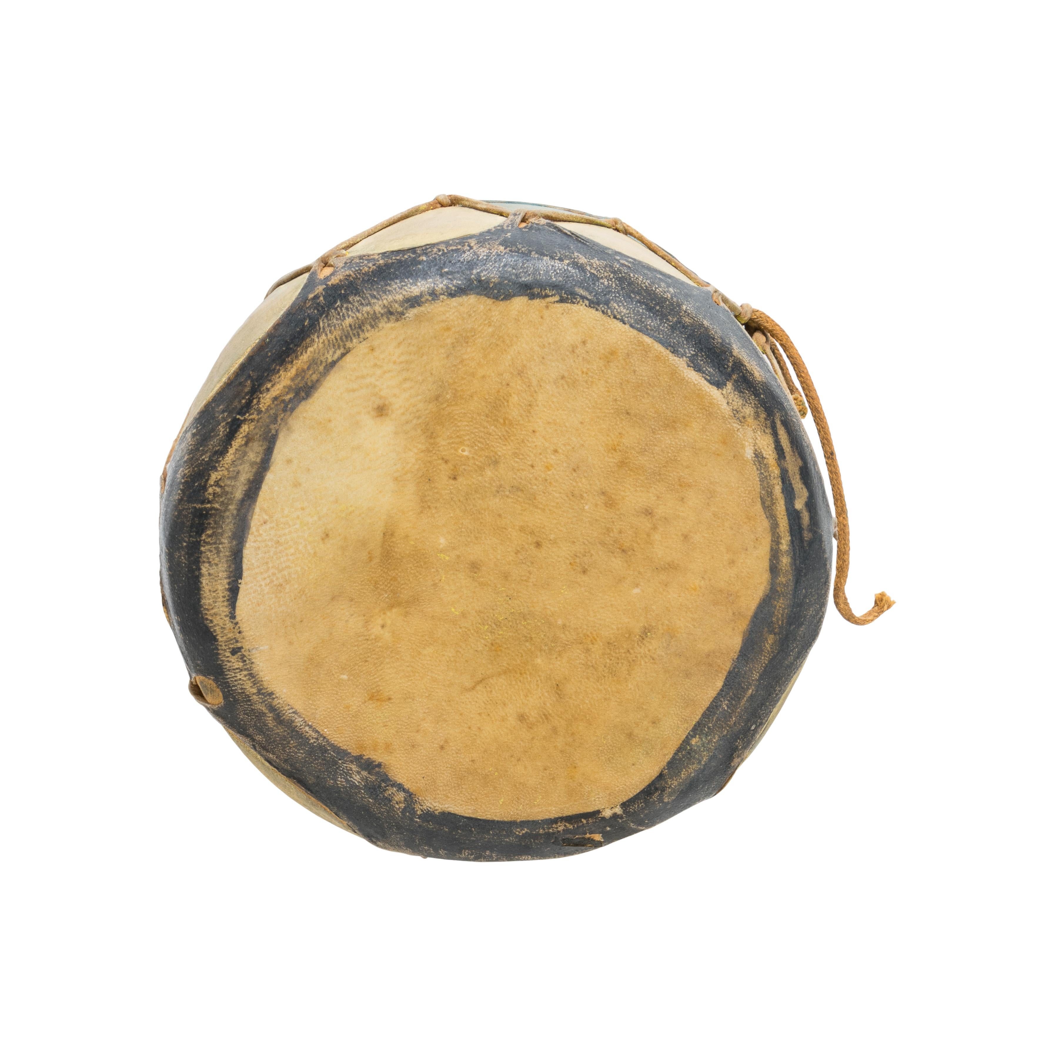 Small Native American Cochiti painted drum with sides painted in mustard yellow and blue with black striping. Made of wood and hide. 

Period: Early 20th century

Origin: Southwest, Cochiti

Size: 7