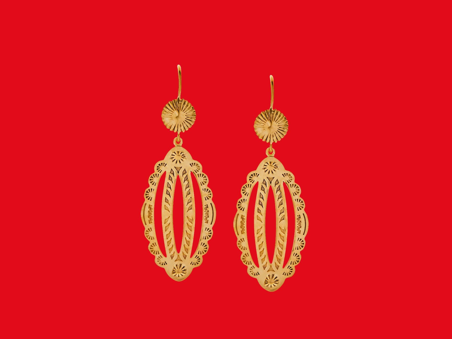 The drop earrings are designed by Christina Alexiou. 
These drop earrings are crafted with 18k yellow gold. As Christina Alexiou notes, she draws on jewellery's ancient purpose as 