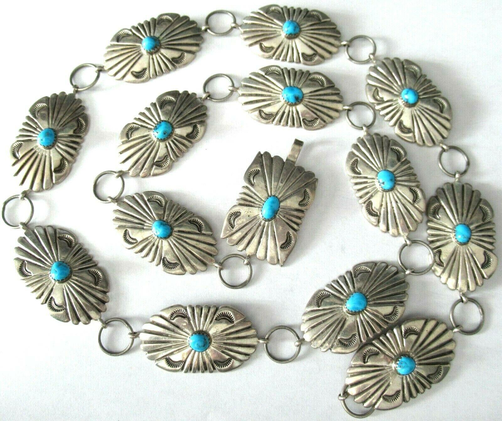 Vintage Navajo Genuine Turquoise Sterling Silver Belt. Each link Hand crafted in Traditional etched designs hand set with a cabochon Turquoise; secured with a hook and ring closure. Excellent Native American craftsmanship.
Measuring approx. 32.5