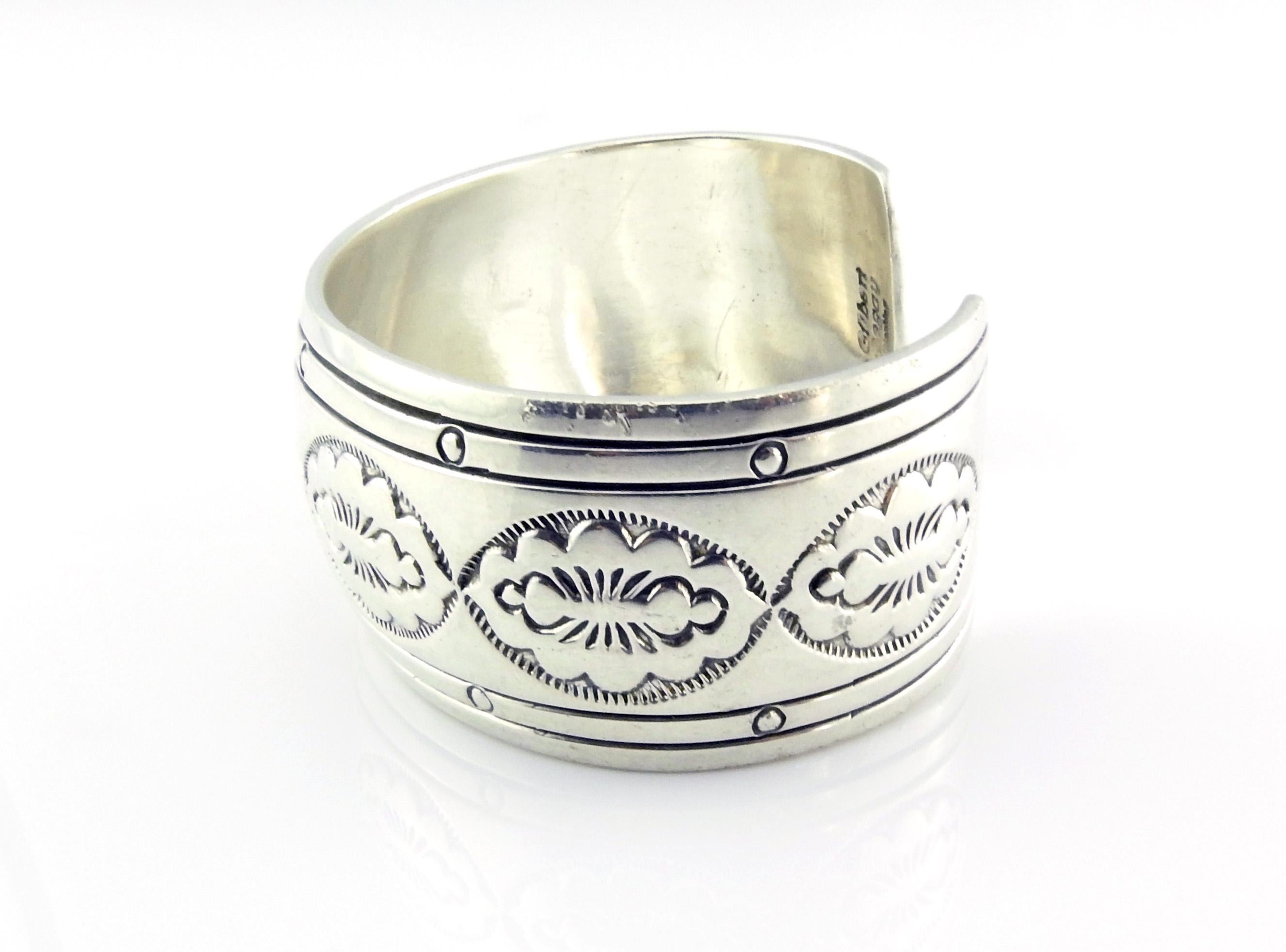 Native American Gilvert Begay sterling silver cuff bracelet.

Stamped oval shape design set in oxidized Sterling.

Marked: Sterling.

Signed: Gilbert Begay.

Measures: 5 7/8