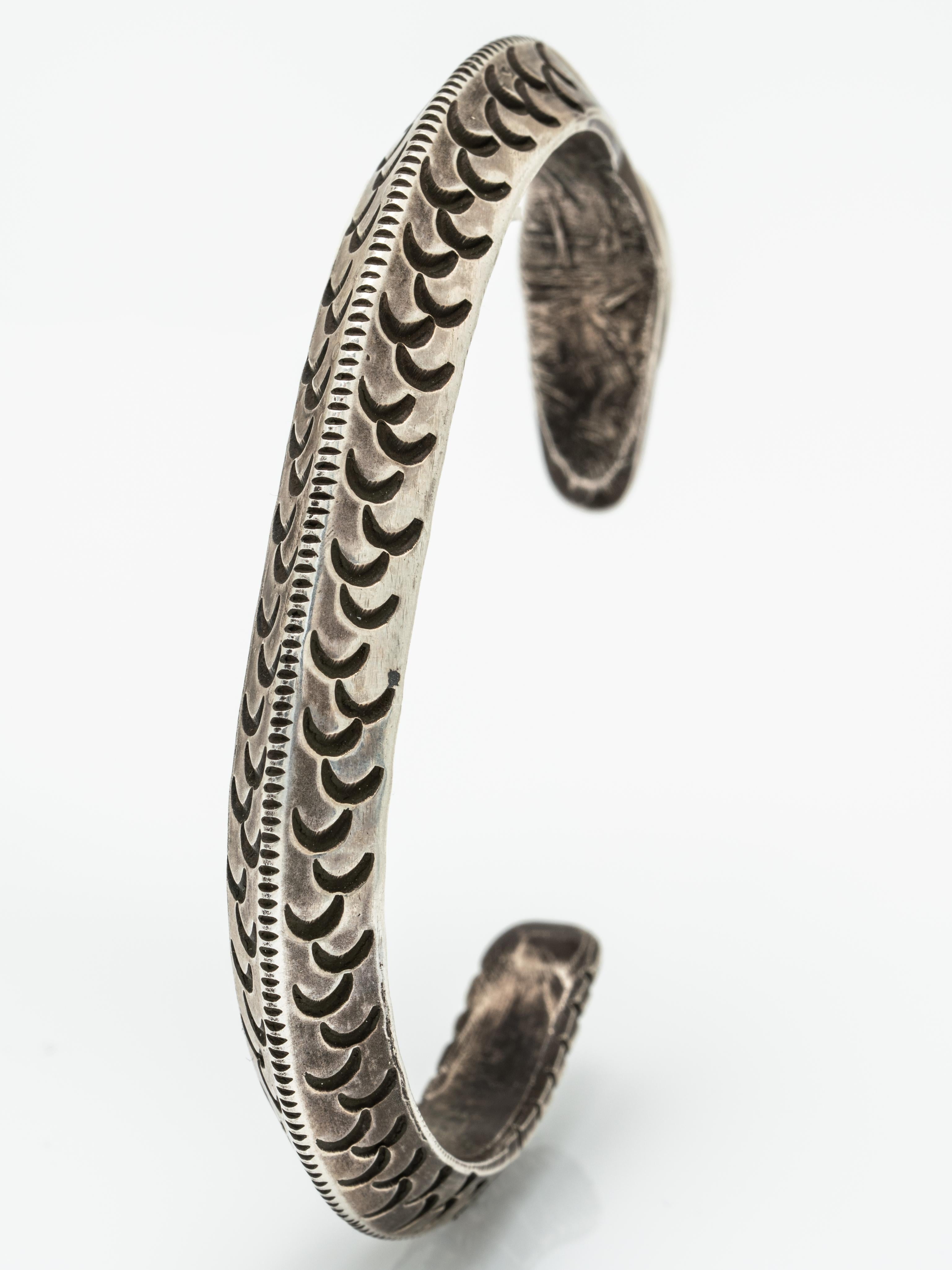Native American Sterling Silver and Turquoise Navajo Snake Cuff 
Hand Engraved, snake motif.
Please excuse the image of the cuff on and the video - it's too large for me - I have very tiny wrists! This would fit someone with a 6.5-8