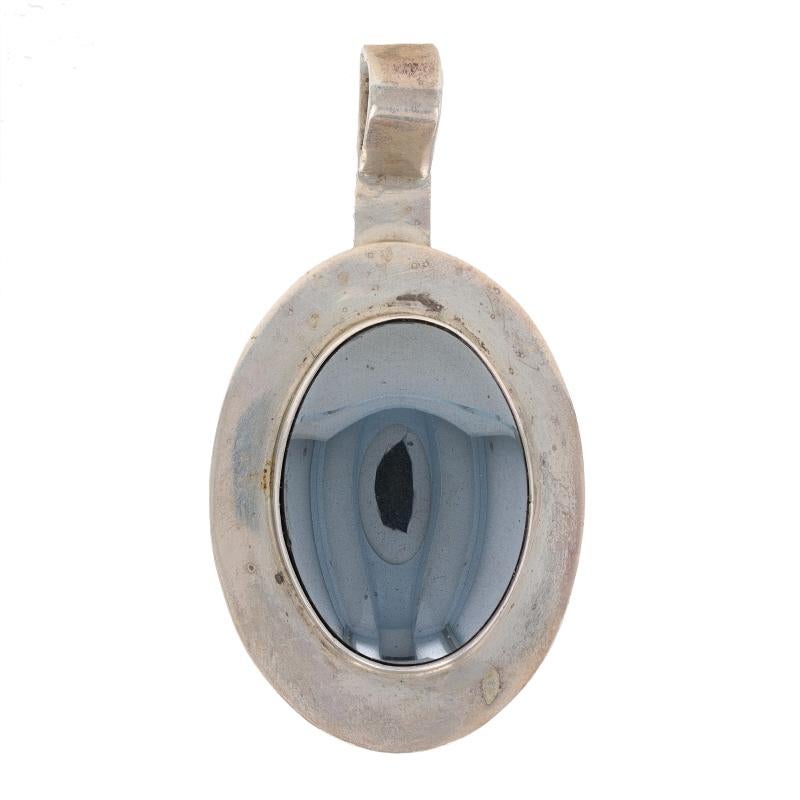 Native American

Metal Content: Sterling Silver

Stone Information
Natural Hematite
Color: Grey

Style: Solitaire

Measurements
Tall (from stationary bail): 2 1/32