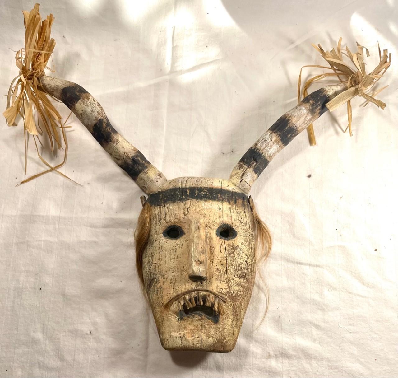 Native American Hopi Pueblo Clown Kachina Mask. Ethnographic Hand Painted Folk Art Collectible.

Vintage Hopi Pueblo Clown Kachina mask made from cottonwood. It is painted with pigments in black and white shades, with added hair and plant fringes.