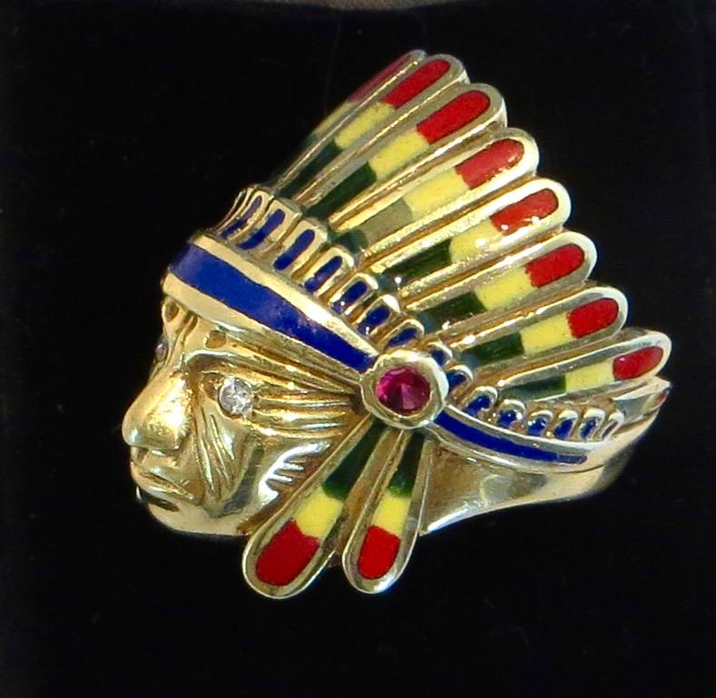 Circa 1955, uniquely designed, well crafted vintage 14k gold ring, depicting an Indian Chief in full headdress regalia with colorful polychrome features. Attention to detail with finely multi colored inlaid enamel feathers in red, yellow green and
