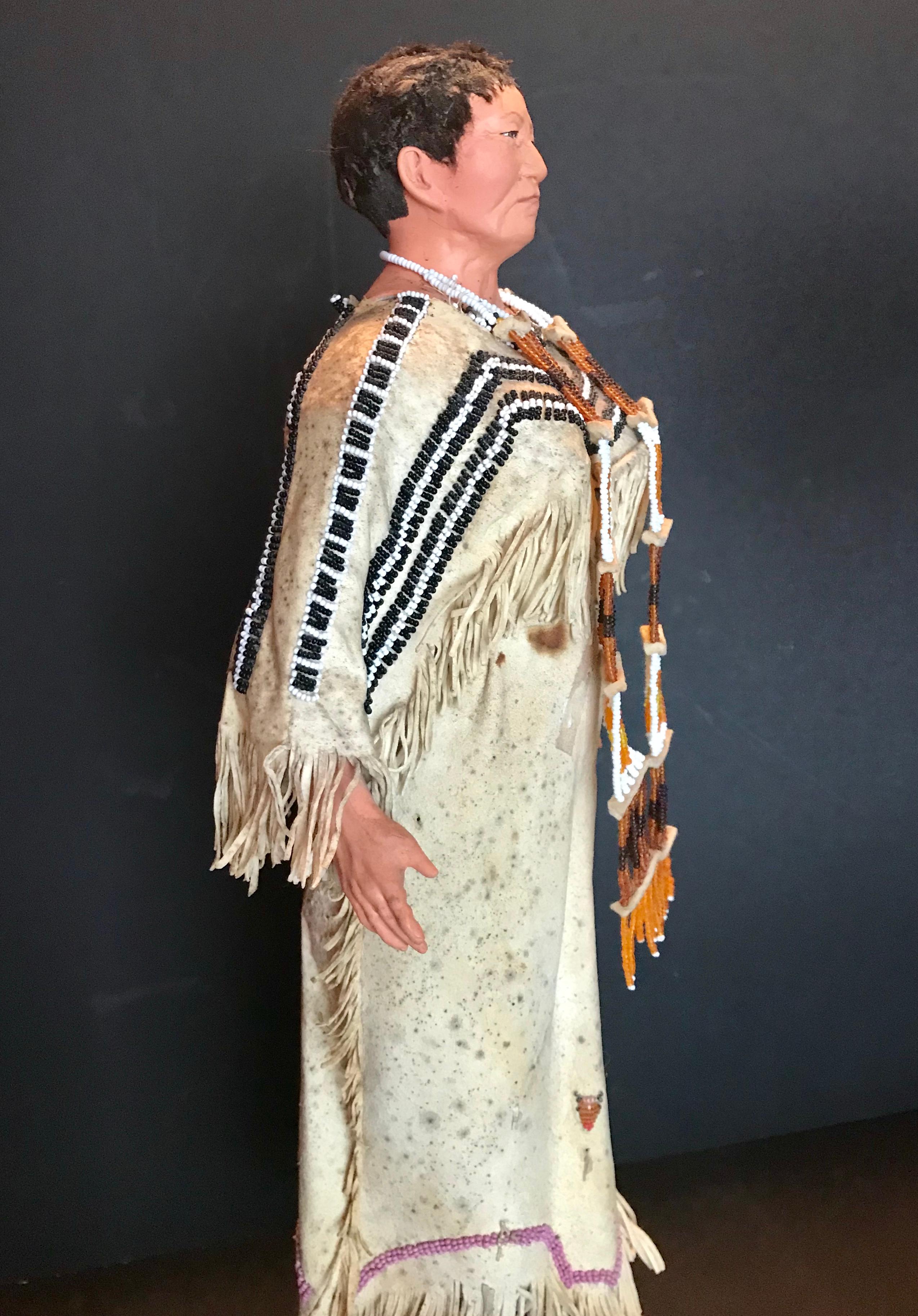 Native American Indian Doll with Traditional Lakota Sioux Cherokee Wedding Dress with Bead-work, One of a Kind

This is an authentic Native American, American made lifelike adult doll. She has a face and hands made from artistically modeled clay.