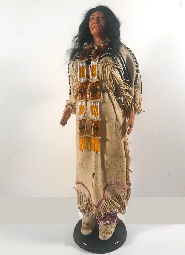 Native American Indian doll with traditional Lakota Sioux Cherokee wedding dress with bead-work, one of a kind

This is an authentic Native American, American made lifelike adult doll. She has a face and hands made from artistically modeled clay.