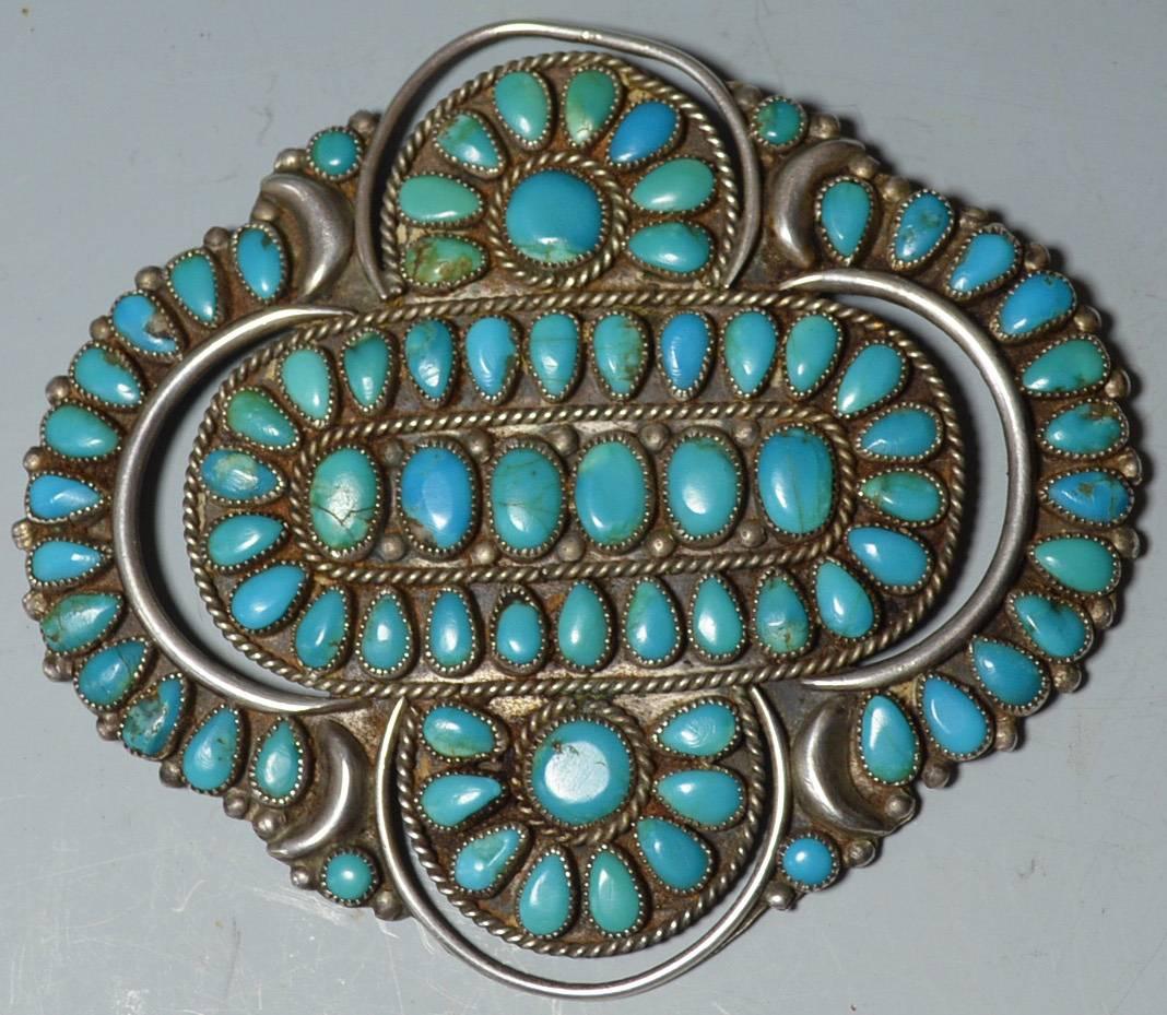 Native American Indian fine large vintage Zuni brooch pendant

A beautiful vintage silver and turquoise brooch with suspension loop to double as a pendant

Size 10.5 x 9.5 cm, 4 1/4 x 3 3/4 inches

Period: 1960, stamped J. M. Begay

Condition: