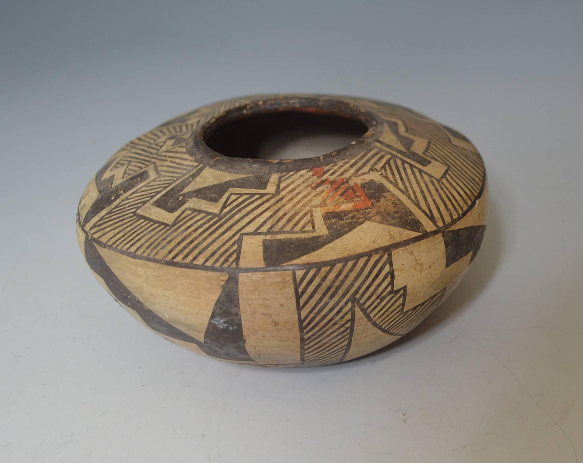 Native American Indian rare vintage Zuni pottery bowl
Cream and white with geometric design
Period 1940 or earlier
Size: Width 6 inches, height 4 1/2 inches,
Condition: Minor rim restoration 


Size 10.5 x 9.5 cm, 4 1/4 x 3 3/4