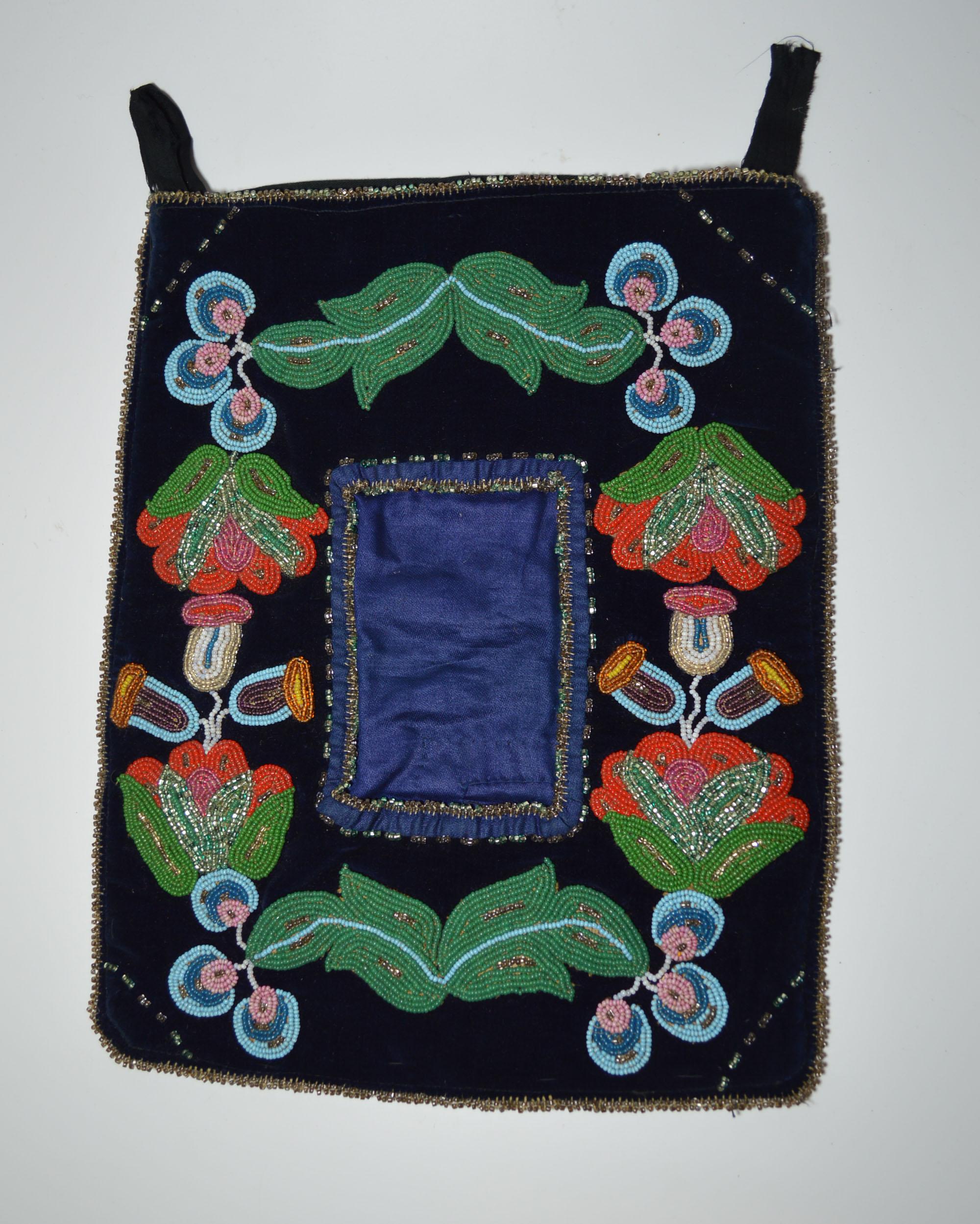 Fine Native American Indian Ojibwe beaded picture frame pocket
Finely beaded on velvet and silk 
Striking floral beadwork designs contrasting beautifully against the dark velvet background
Period Early 20th century
Condition: Minor bead work