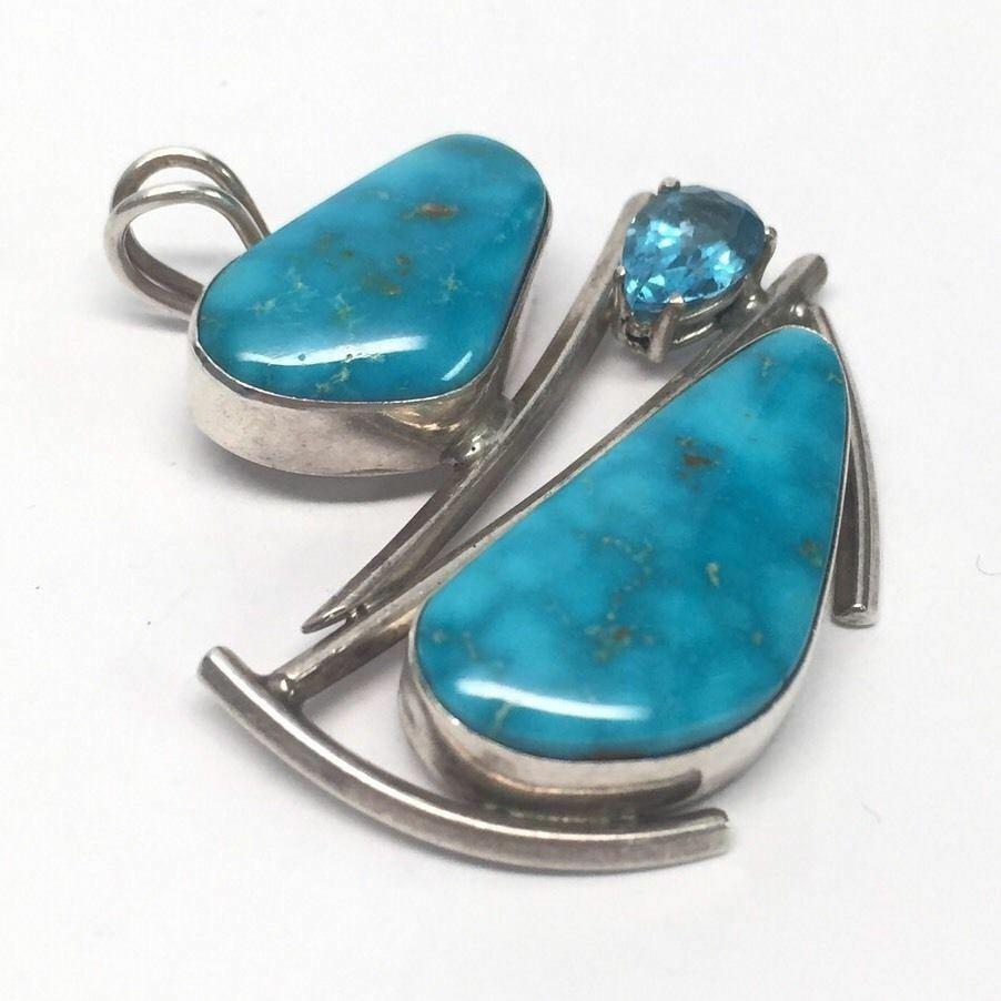 Native American Les Baker Sterling Silver turquoise and blue topaz pendant.

Marking: STERLING, L, eagle, B, TOLEDO.

Measures approx. 1 1/2