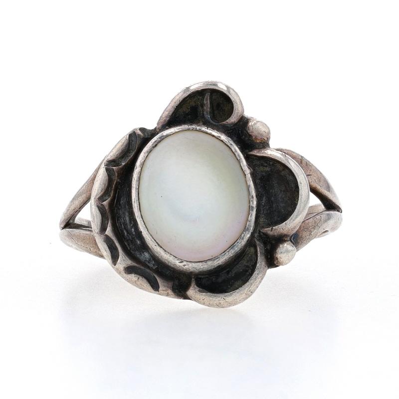 Size: 8

Native American

Metal Content: Sterling Silver

Stone Information
Natural Mother of Pearl
Color: White

Style: Cocktail Solitaire
Theme: Flower
Features: Split Shoulders

Measurements
Face Height (north to south): 21/32