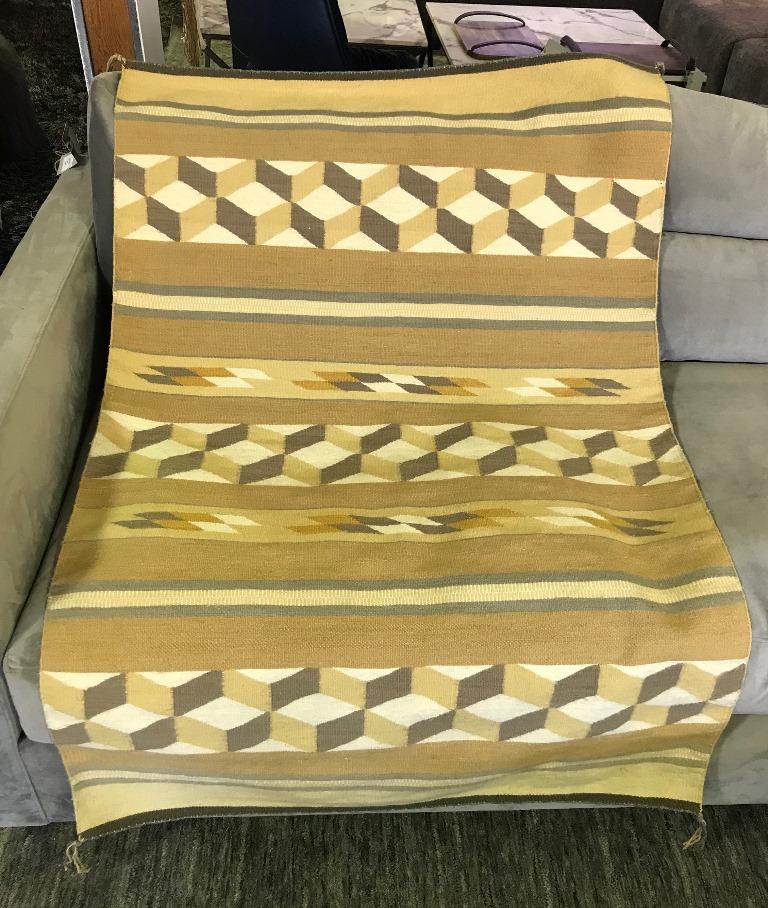 Beautiful coloring and geometric patterns for which the Navajo tribe is famed. In fantastic vintage condition. Originally acquired some 50-60 years ago and placed in storage for good keeping. Ingeniously clever design. The pattern changes when
