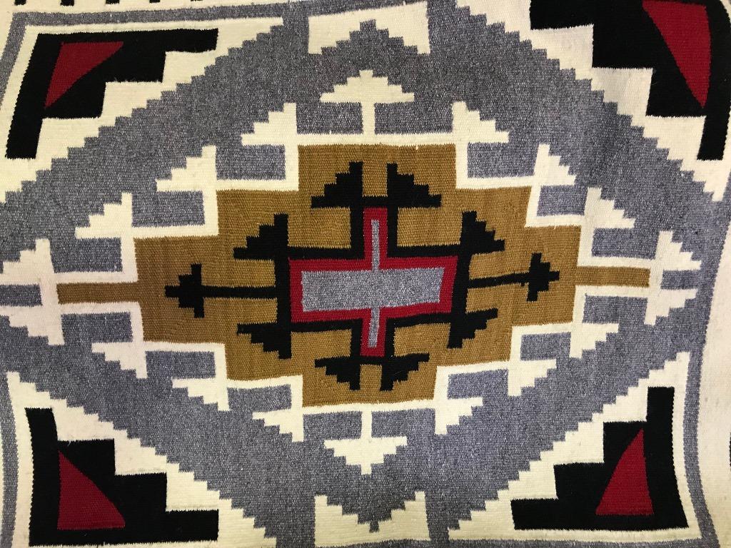 A nicely woven geometric pattern of which the Navajo tribe is famed. In fantastic vintage condition. Originally acquired some 50-60 years ago and placed in storage for good keeping. From a large collection of Native American artifacts and