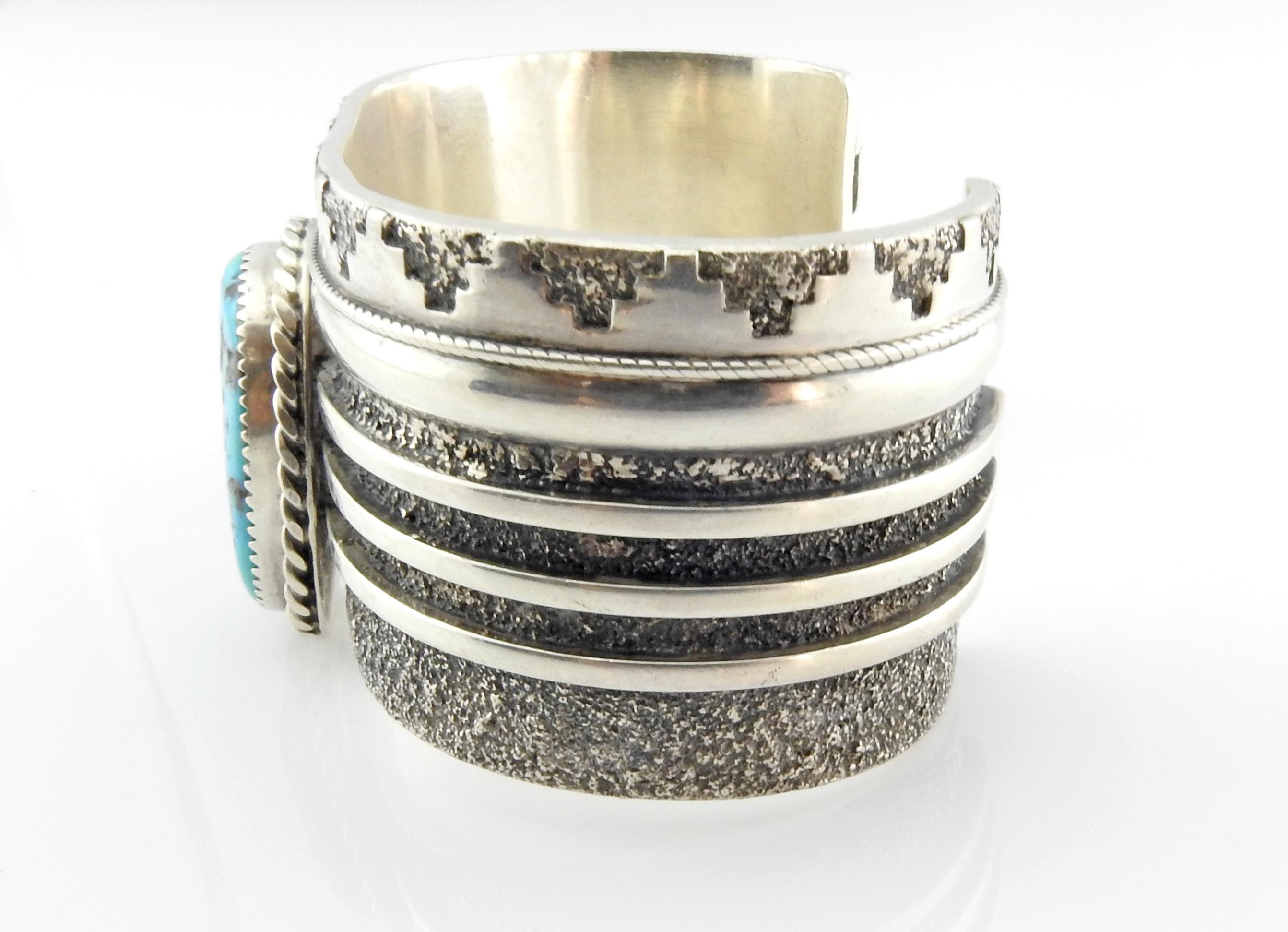 Native American Navajo L. Begay sterling silver turquoise stamped and textured cuff bracelet.

Marked: Sterling, L.Begay

Measures: 5 5/8