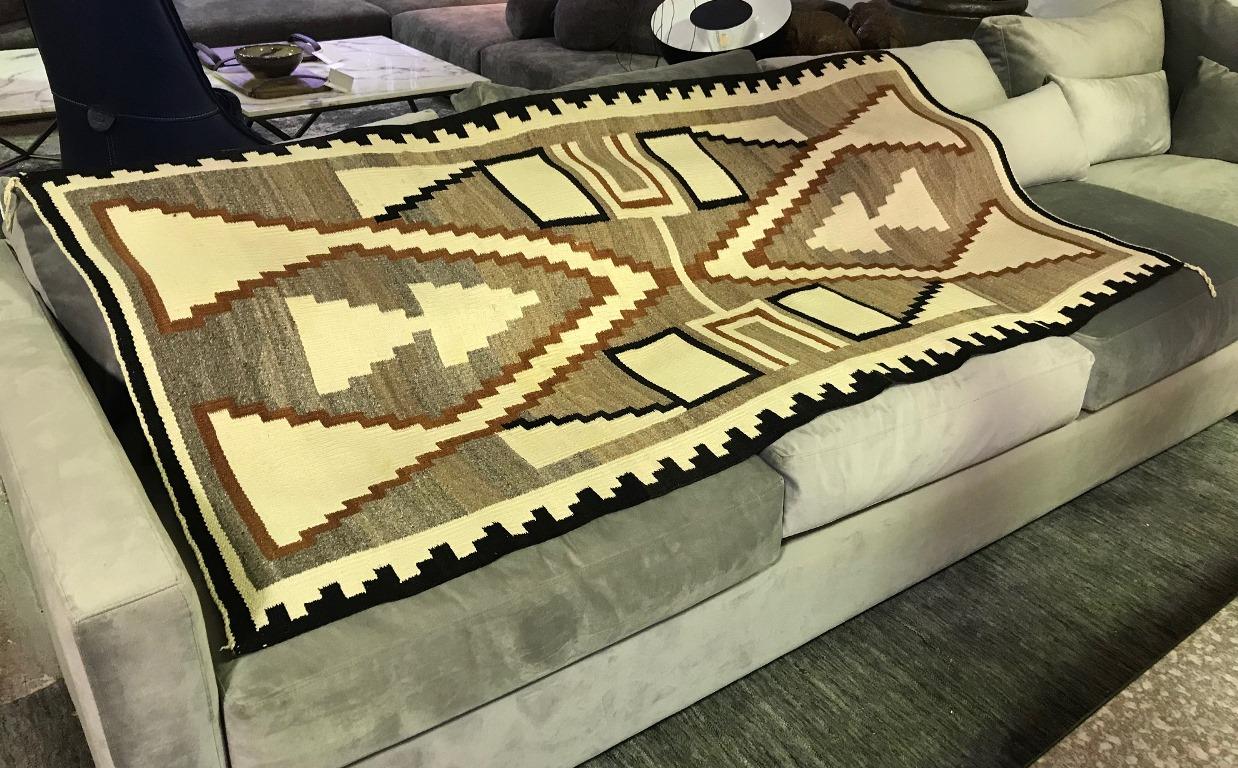 A wonderful geometrically designed storm pattern (of which the Navajo tribe is famed for) rug/ blanket. In fantastic vintage condition. Originally acquired some 50-60 years ago and placed in storage for good keeping. From a large collection of