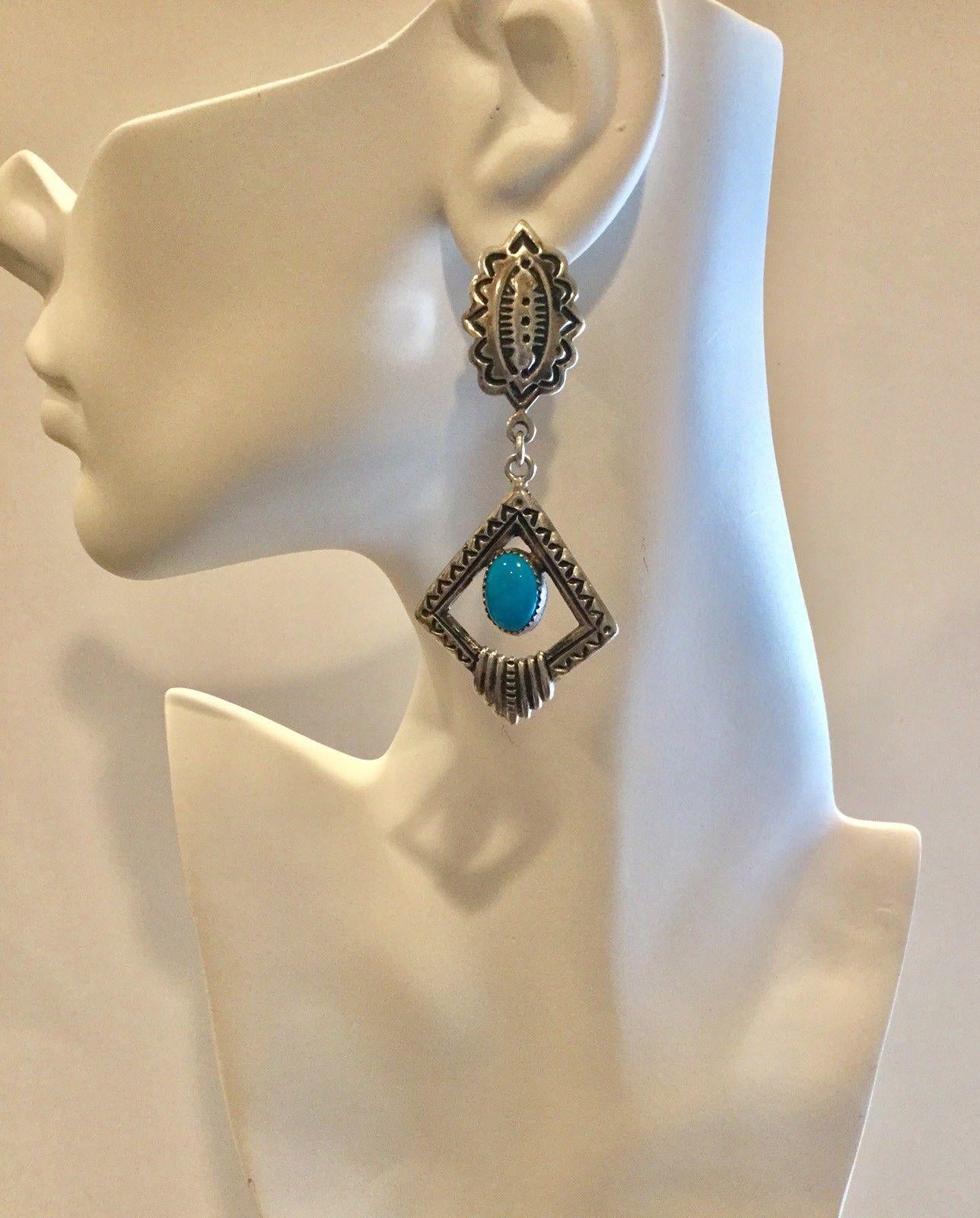 Native American Navajo Randall Tom sterling silver turquoise dangle earrings.

Marked: R.Tom, Sterling

Measures: 3