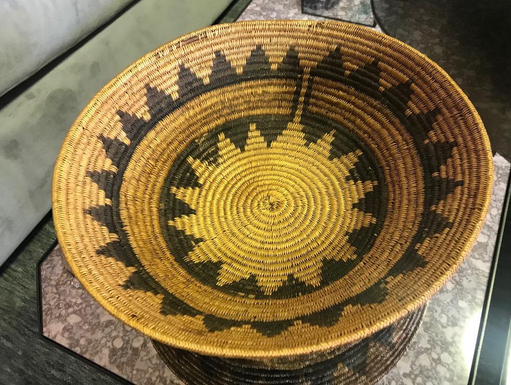 A wonderful designed, large rounded basket by the Southwestern Native American Navajo Tribe. Originally presented and used in a traditional tribal wedding ceremony. The piece is nicely weaved and beautifully decorated with a traditional geometric