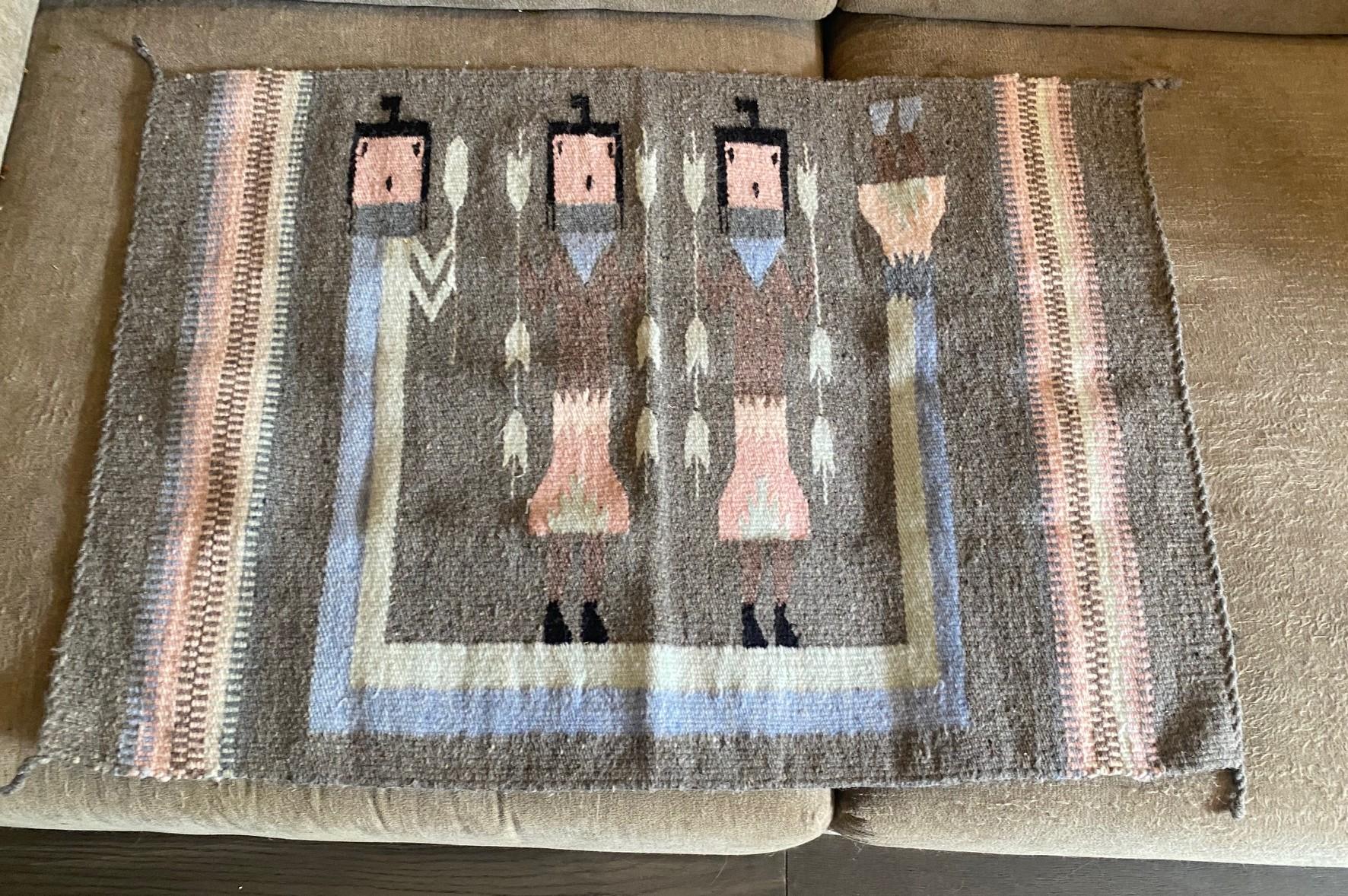 A beautifully composed and colored, intricately woven Navajo Yei pictorial rug/blanket/wall hanging featuring three Navajo dancers portraying a Yei (Yeibichai) characters. Yei is the Navajo name for benevolent, holy beings who possess supernatural