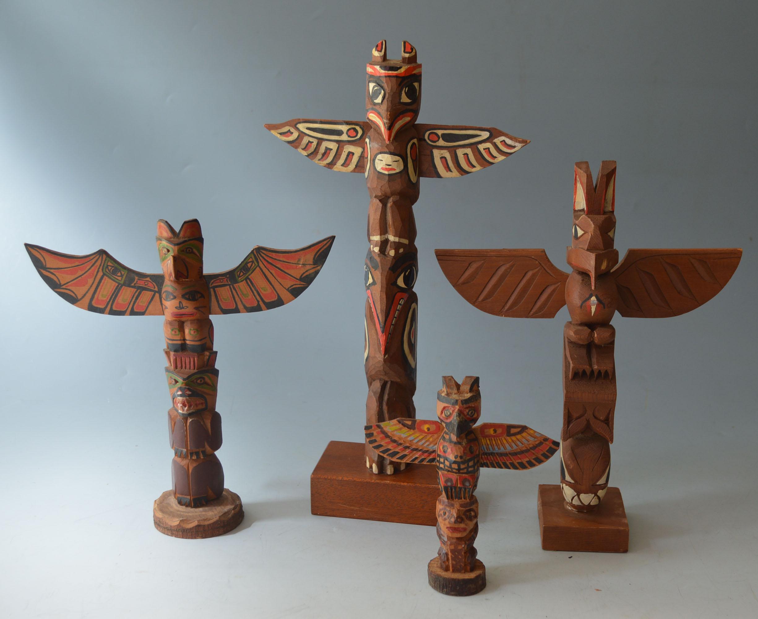 Native American North West Coast Totem Group Haida Tlingit
A group of 4 vintage carved and painted cedar wood totems
Vancouver BC signed my makers one dated 1966 
Measures: height 31, 24, 21, 13 cm size not inc base
12.5 inches
9.5 inches
8.5