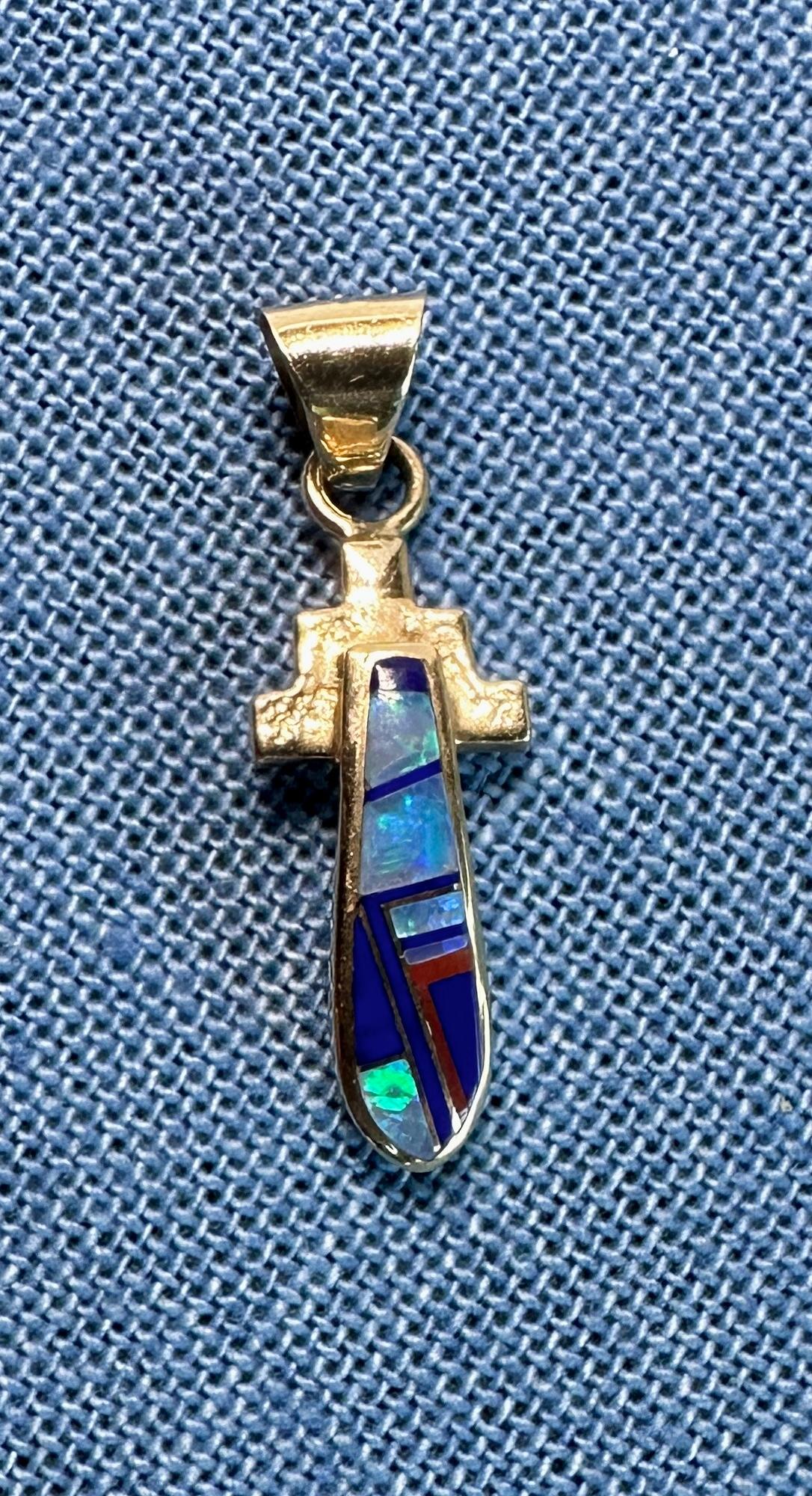 THIS IS A WONDERFUL NATIVE AMERICAN OPAL LAPIS LAZULI PENDANT IN 10 KARAT YELLOW GOLD.  

The fabulous native american pendant has gorgeous inlay work in gold with opal and lapis lazuli as well as a redish stone that may be carnelian or coral. 
The