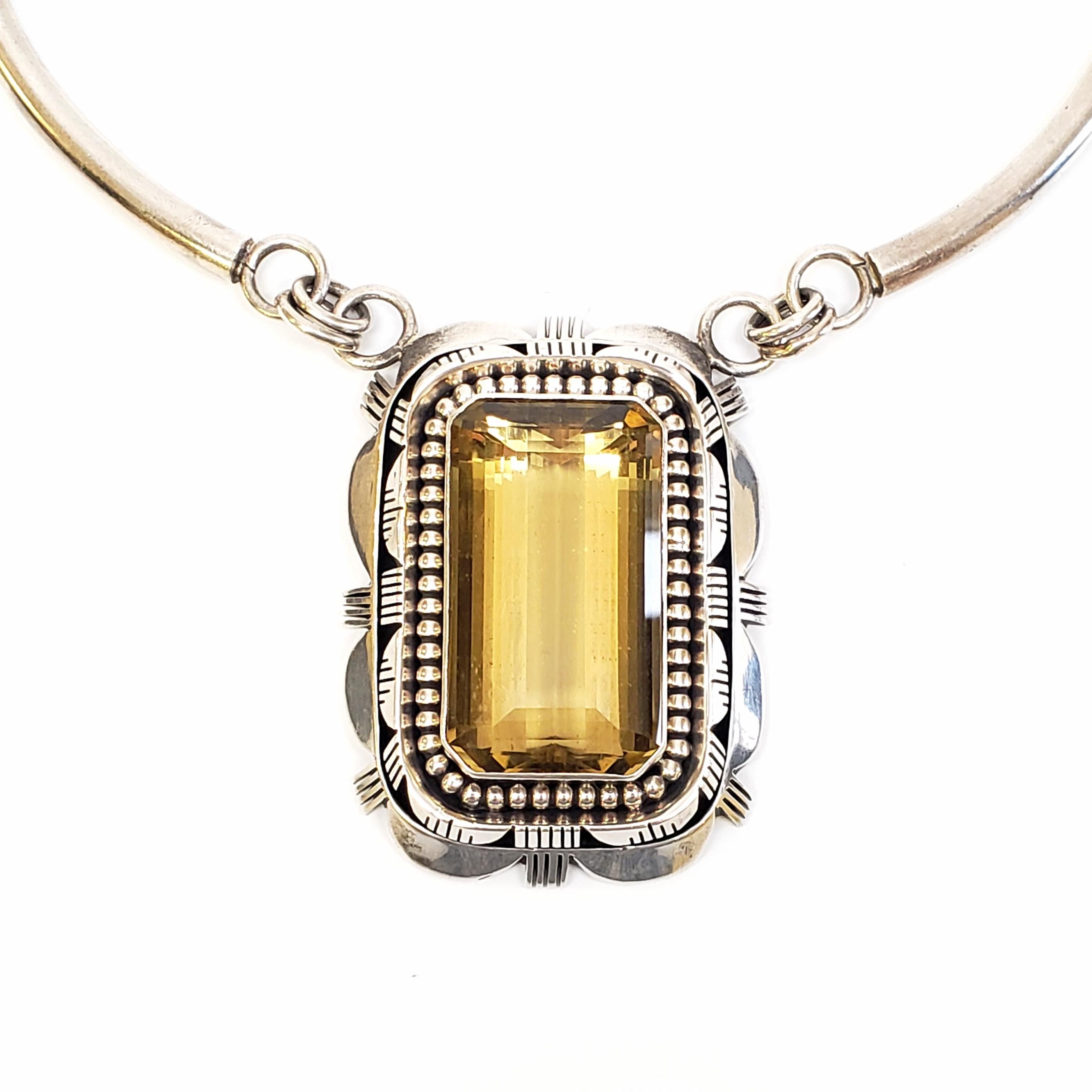 Sterling silver necklace with large citrine pendant by Native American Navajo artisan, Paul Livingston.

Paul Livingston is a highly respected silversmith known for his intricate saw work. His pieces are highly collectible. This piece features a