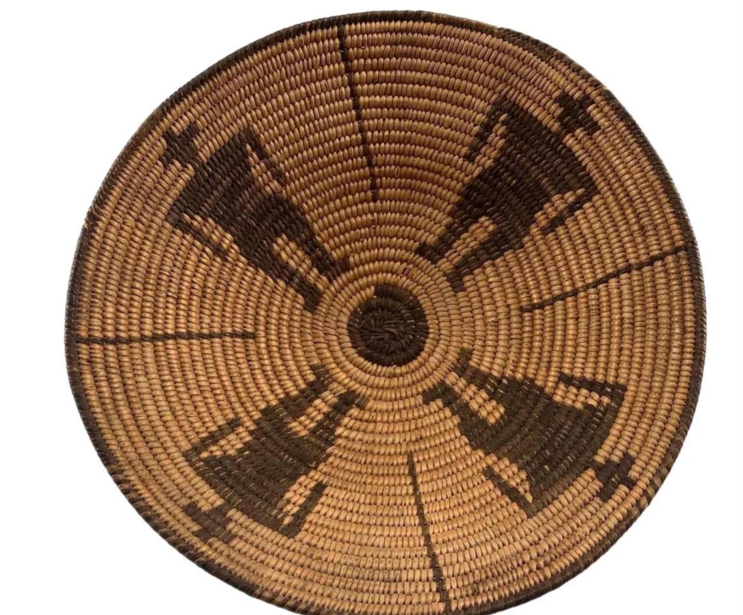 Native American pictorial pima basket with geometric figural motif, having four figures, circa. 1920s. Made of bear grass, Devil's claw and willow. Excellent condition.