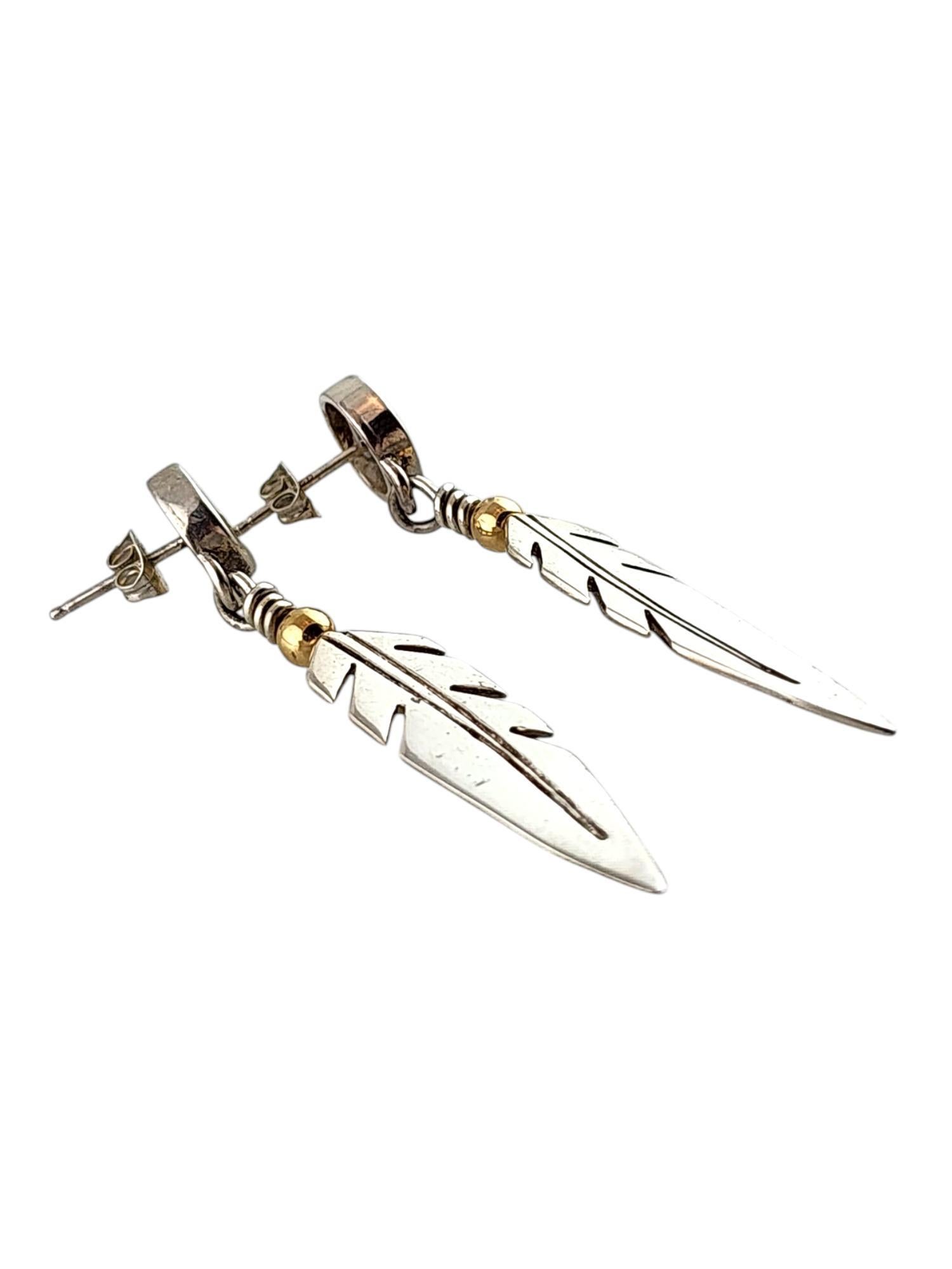 Sterling Silver Ray Tracey Native American Eagle Feather Earrings

These beautiful Native American earrings by Ray Tracey were crafted with amazing detail from sterling silver to look like eagle feathers!

Size: 52.35mm X 9.4mm X 9.15mm

Weight: