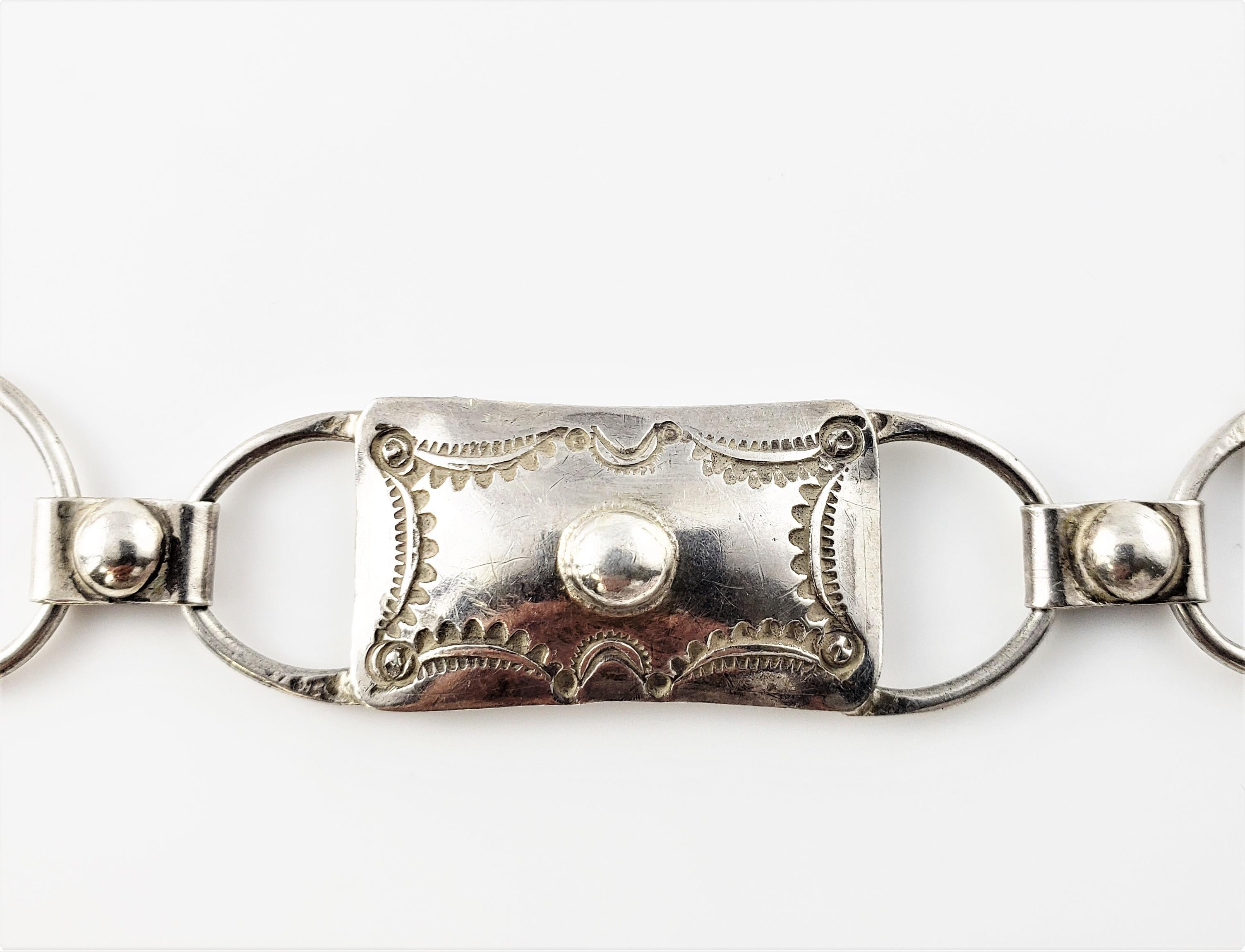 Vintage Native American Silver Rectangle Concho Belt-

This lovely Native American Concho belt is crafted in beautifully detailed silver.

Size: 30.5 inches x .75 inch

Weight: 52.9 dwt. / 82.3 gr.

Silver purity unknown.