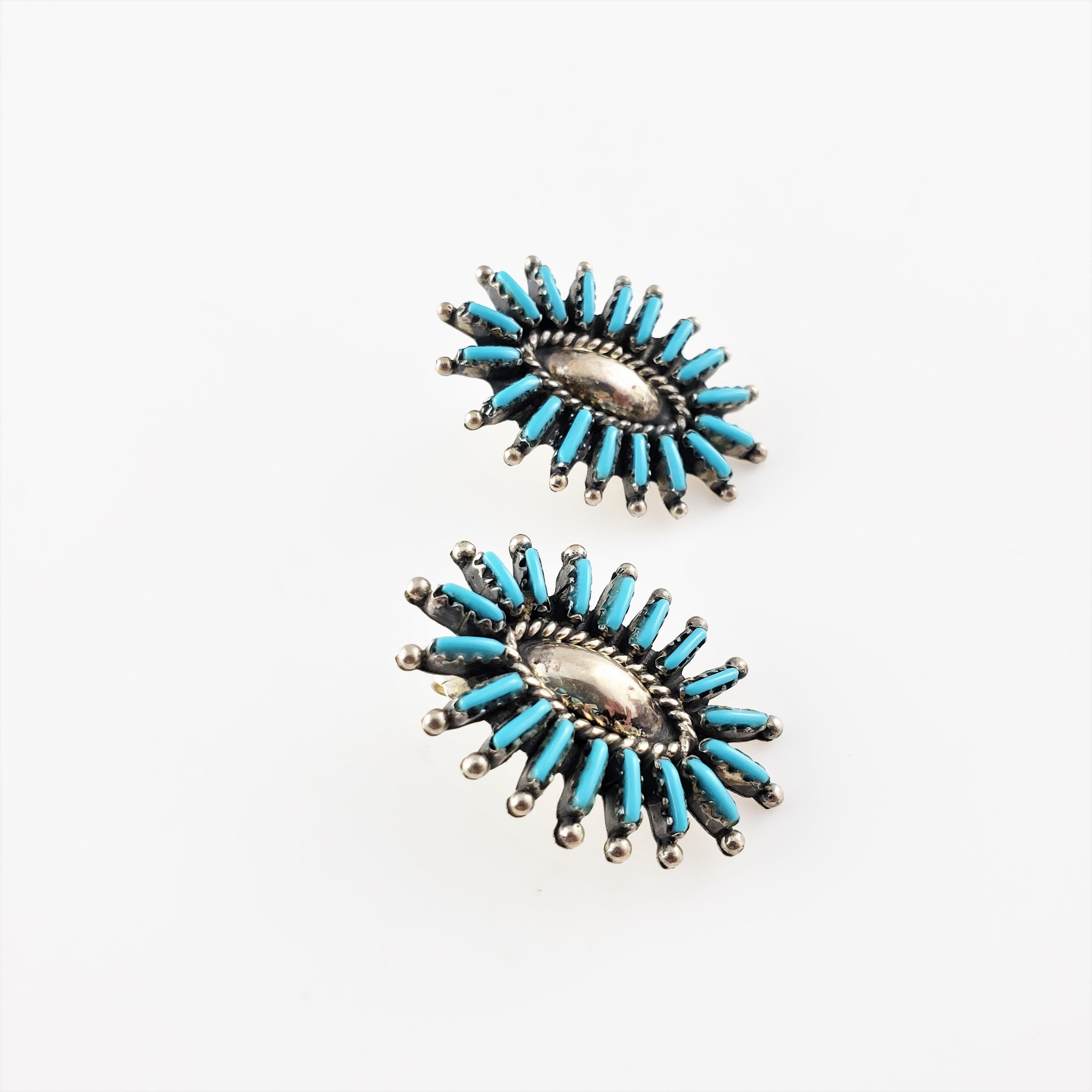 Vintage Native American Signed LA Sterling Silver Needlepoint Turquoise Earrings-

These lovely Native American earrings are decorated with needlepoint turquoise stones (5 mm x 1 mm each) set in beautifully detailed sterling silver. Push back