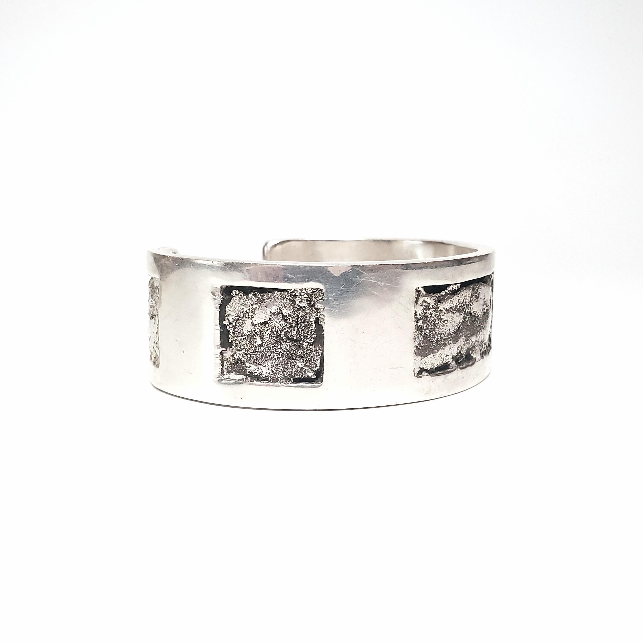 Sterling silver cuff bracelet by Native American artisan, signed LL.

Heavy and substantial cuff bracelet with unique and interesting design.

Measures approx 6 3/4