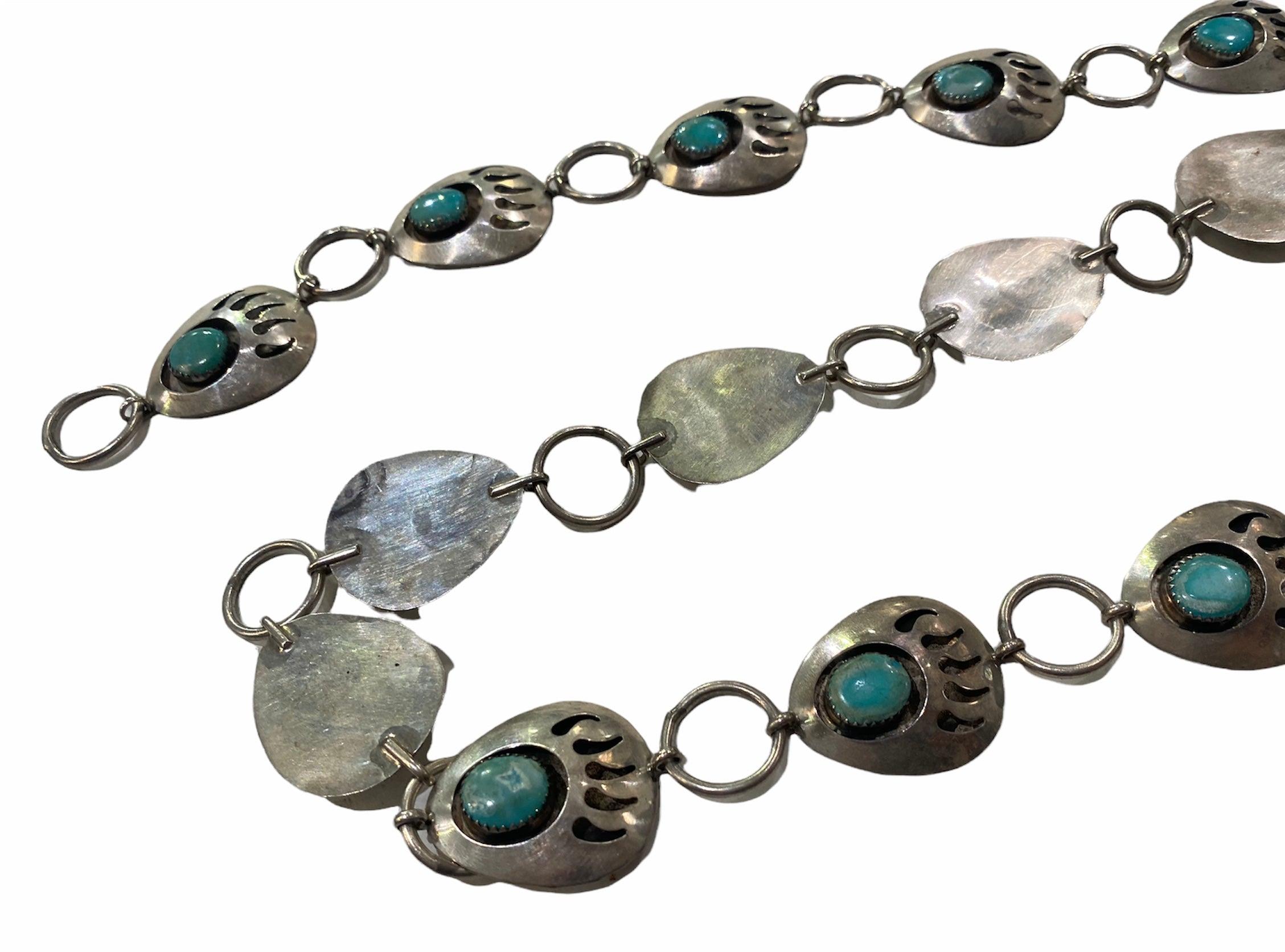 Lovely vintage Native American concho belt with bear claw motif. Each section is raised, hollow and set with turquoise with sawtooth bezel. Beautifully made and in excellent condition.

Additional information:
Dimensions: Length: 36