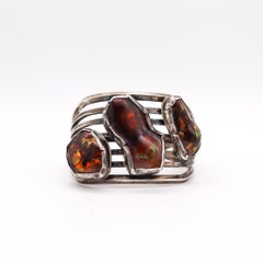 Bracciale nativo americano del sud-ovest in argento con opali di fuoco graduati