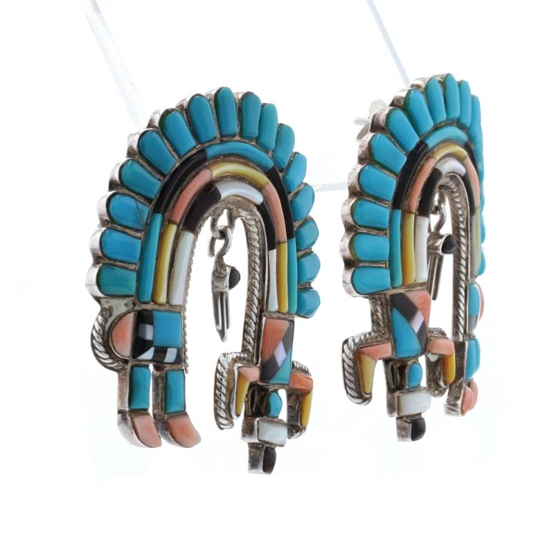 Native American
Design: Rainbow Man

Metal Content: Sterling Silver

Stone Information: 
Genuine Turquoise
Treatment: Routinely Enhanced
Color: Blue

Genuine Jet
Color: Black

Genuine Mother of Pearl
Colors: White & Yellow

Genuine Coral
Color: