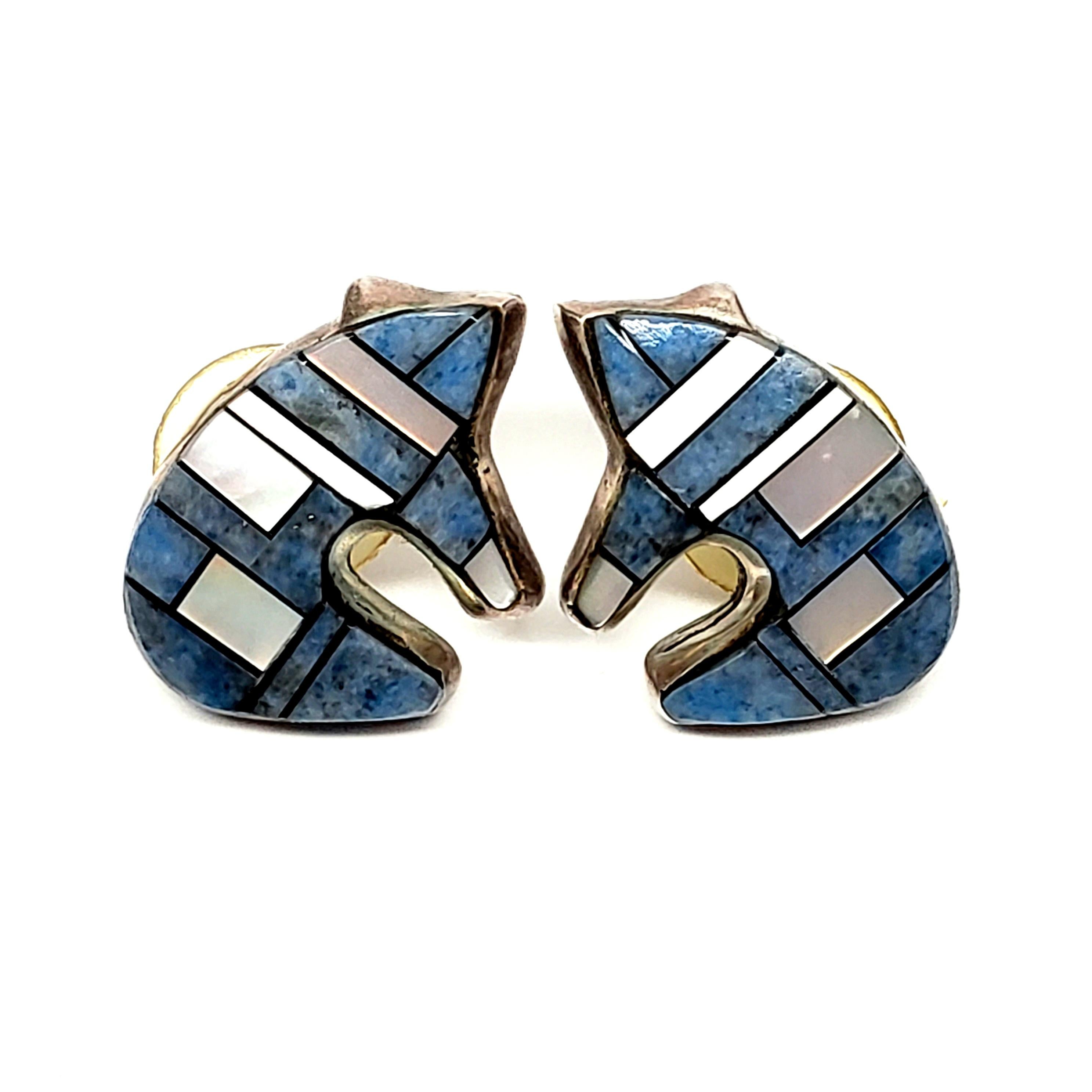 Sterling silver and inlay mosaic bear earring by Native American artisan, signed AY.

The bear symbolizes a fierce warrior and great hunter. Features beautiful and intricate channel inlay of denim lapis lazuli and mother of pearl.

Measures approx